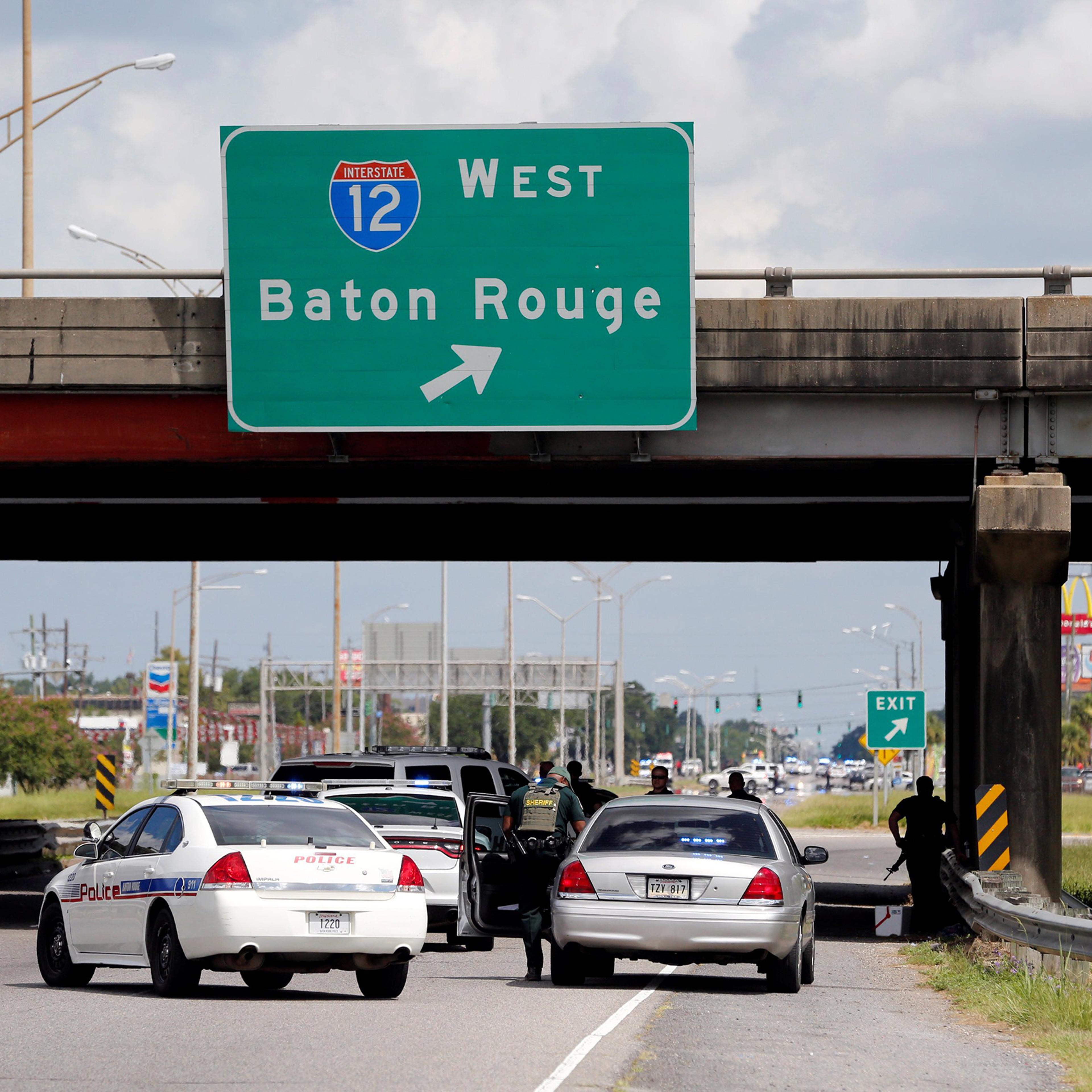 Police officers block off a road after a shooting of police in Baton Rouge, Louisiana, July 17, 2016.