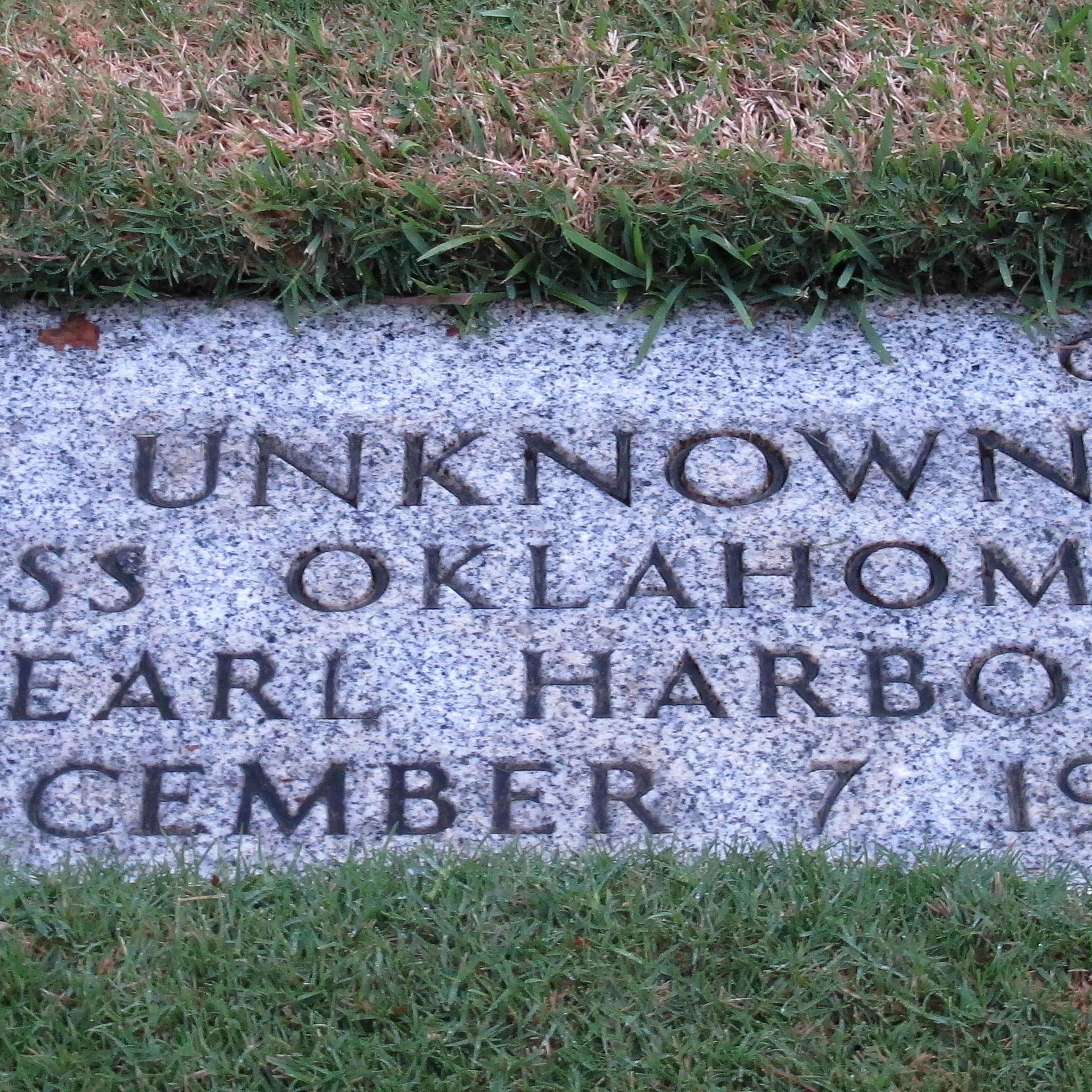 This Dec. 5, 2012 photo at the National Memorial Cemetery of the Pacific in Honolulu shows a gravestone of 7 unknowns from the USS Oklahoma