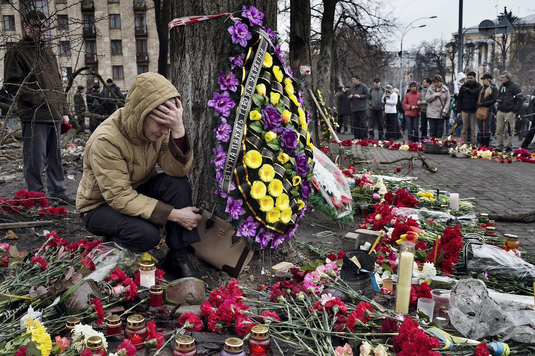 A woman mourns at a memorial for protesters killed in Kiev’s recent violence.