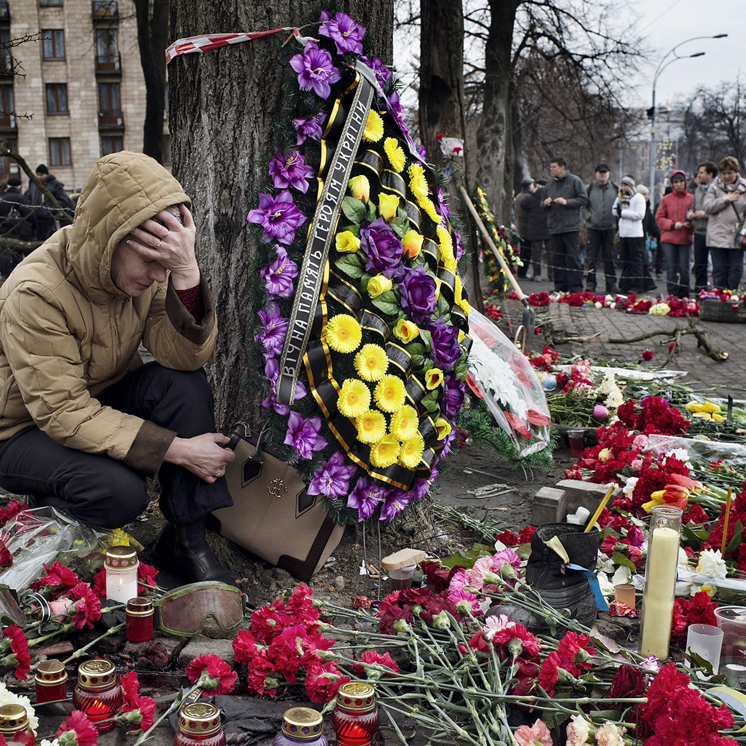 A woman mourns at a memorial for protesters killed in Kiev’s recent violence.