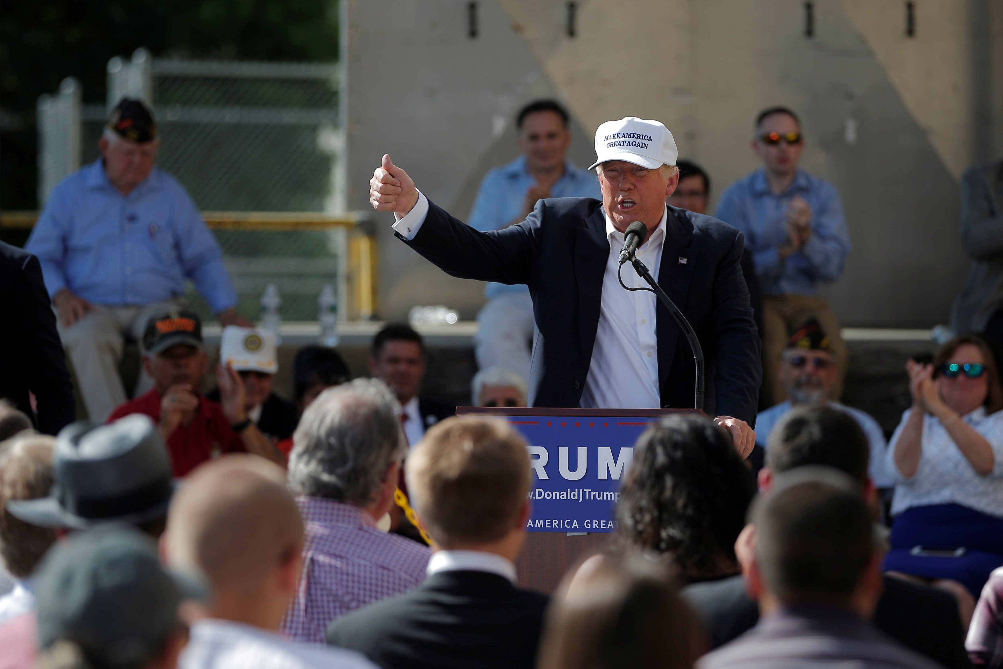 U.S. Republican presidential candidate Donald Trump speaks at a campaign town hall meeting outside a closed Osram Sylvania manufacturing facility in Manchester