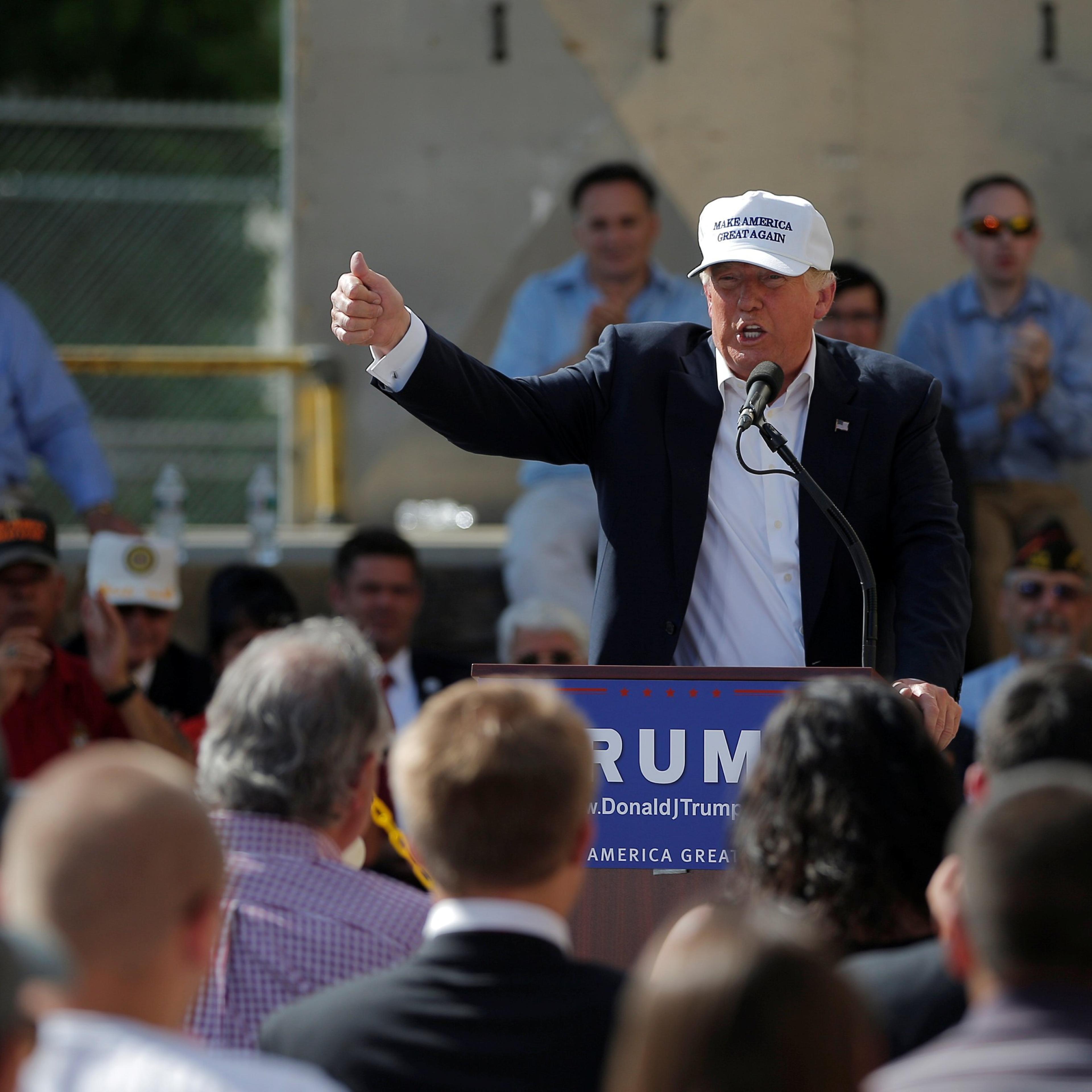 U.S. Republican presidential candidate Donald Trump speaks at a campaign town hall meeting outside a closed Osram Sylvania manufacturing facility in Manchester