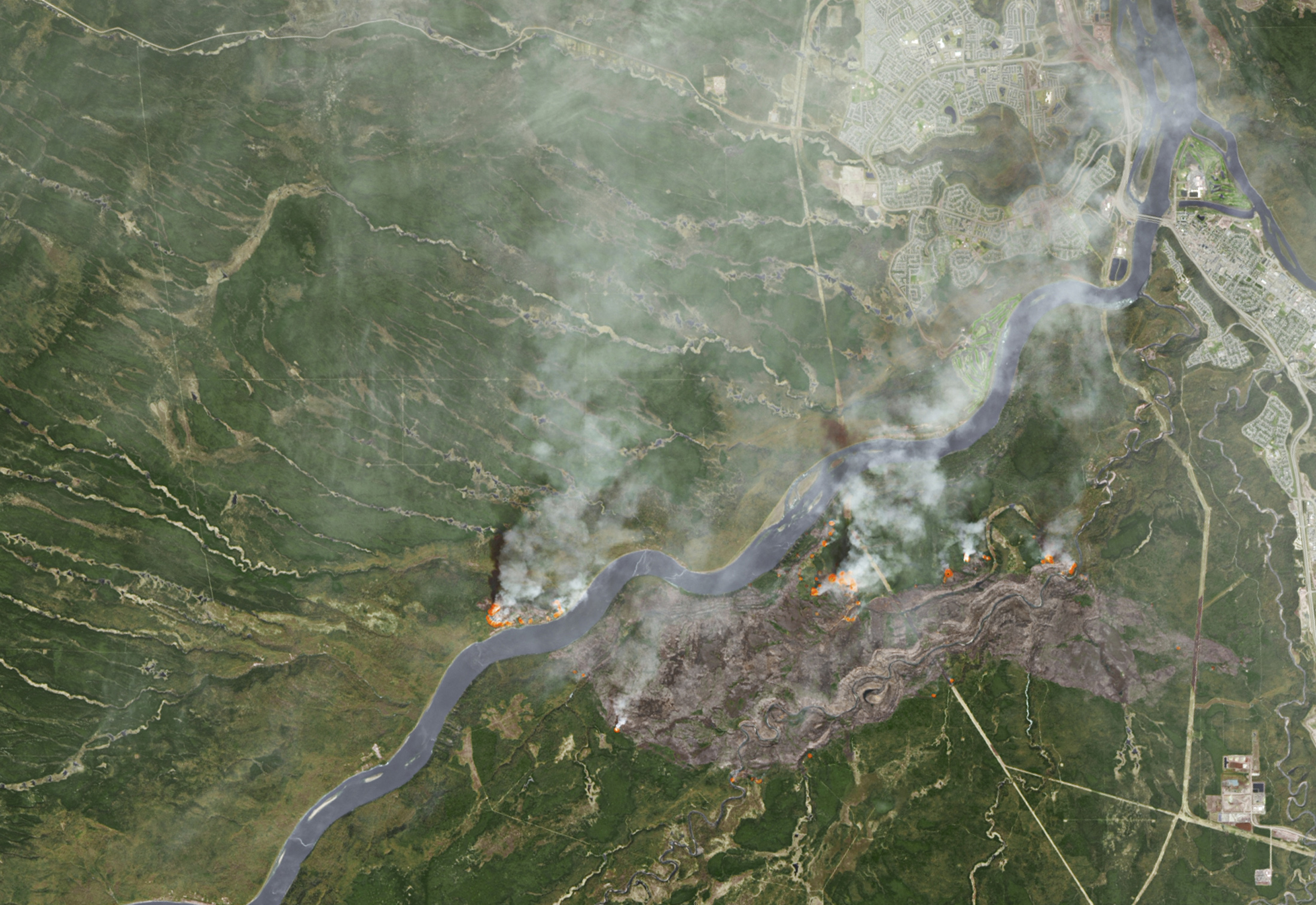 Smoke from wildfires near Fort McMurray in Alberta are shown in this NASA satellite photo captured on May 3, 2016.