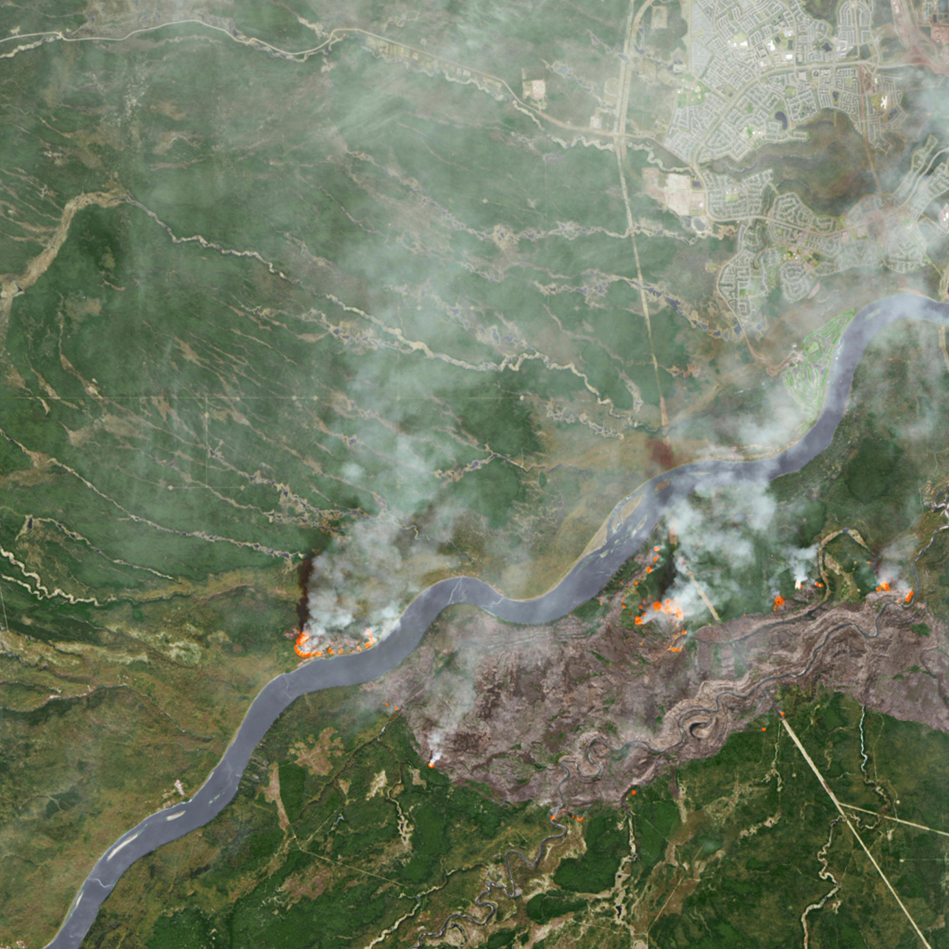 Smoke from wildfires near Fort McMurray in Alberta are shown in this NASA satellite photo captured on May 3, 2016.