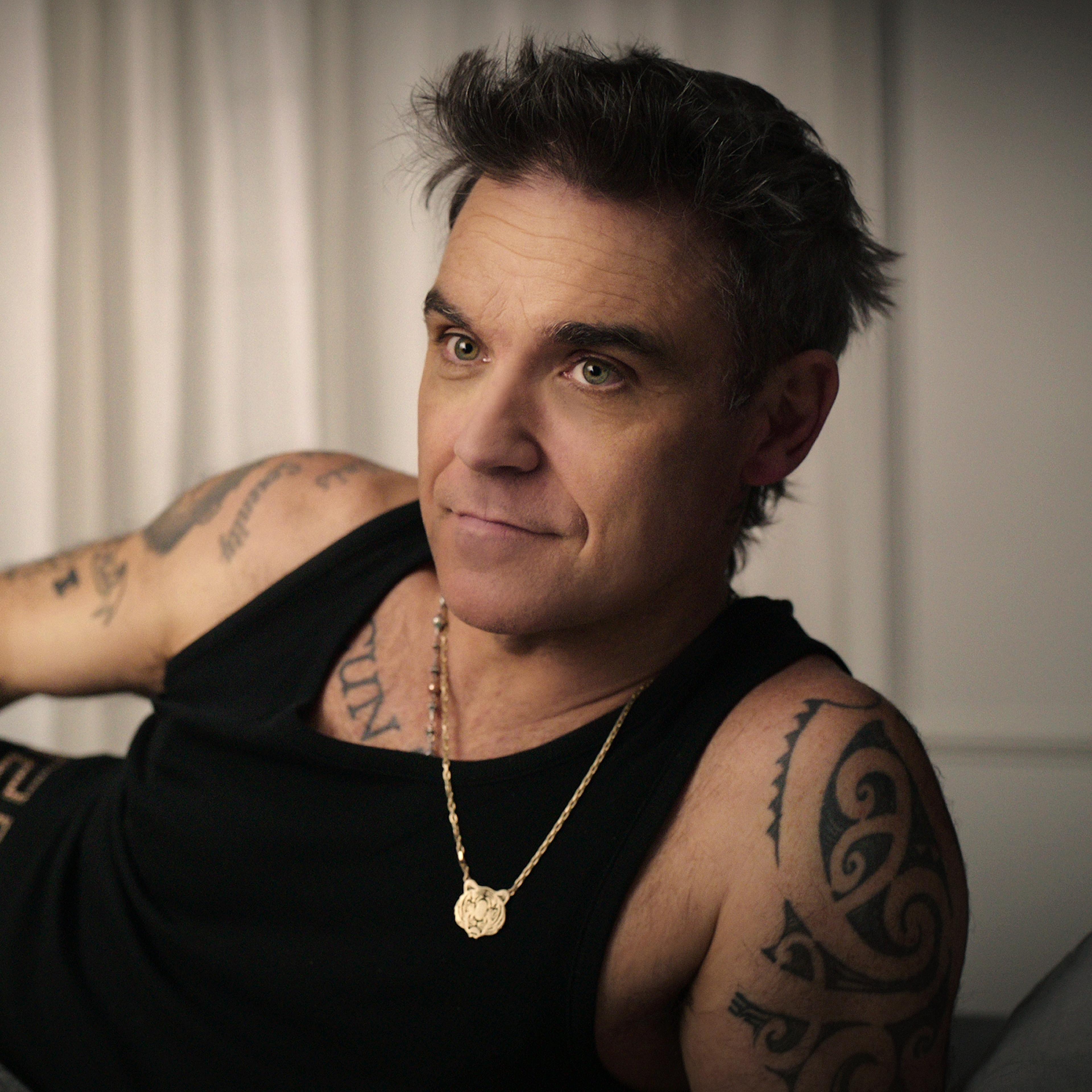 Robbie Williams revisits his colourful life and career in a new four-part Netflix documentary.