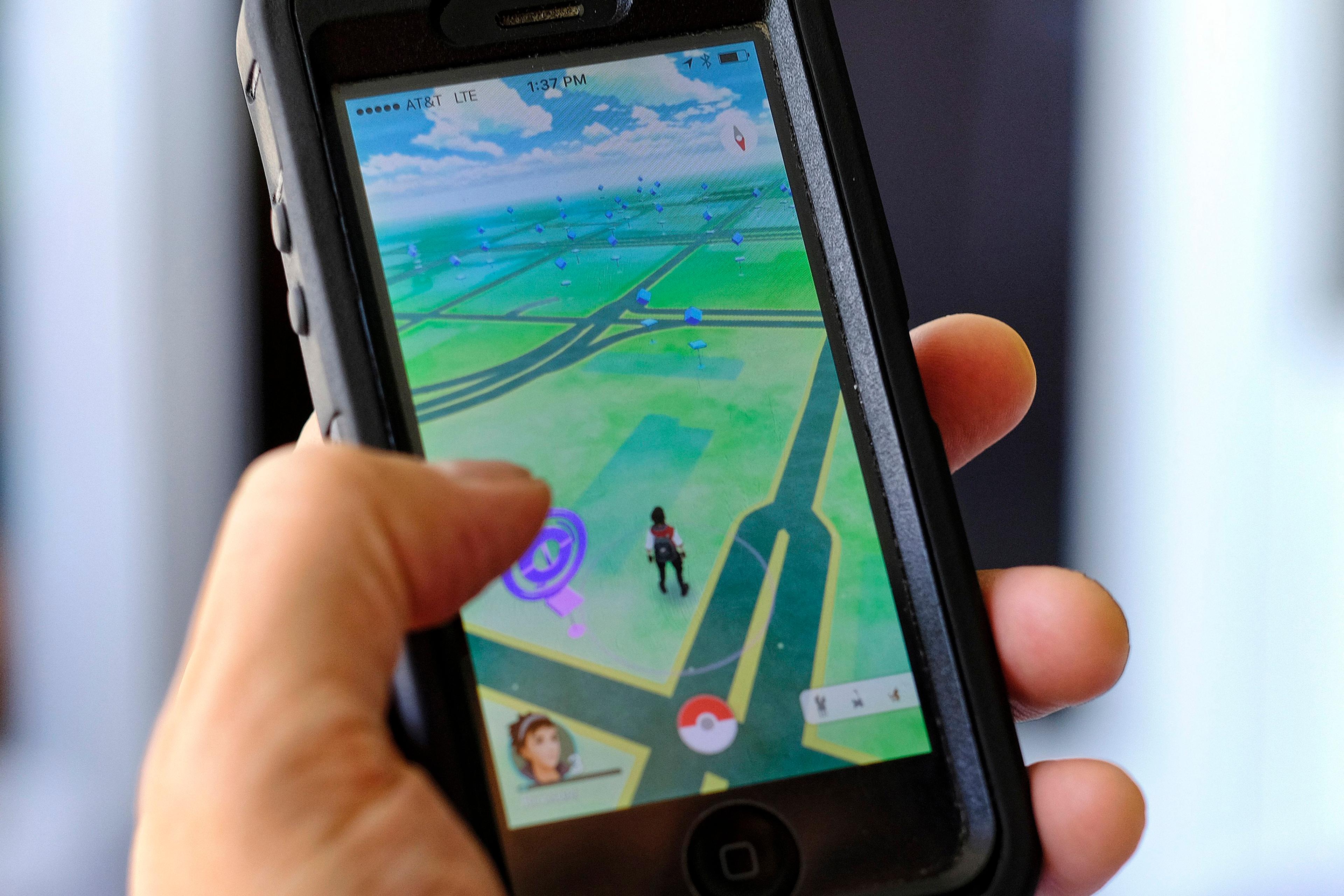 Pokemon Go is displayed on a cell phone in Los Angeles, July 8, 2016.
