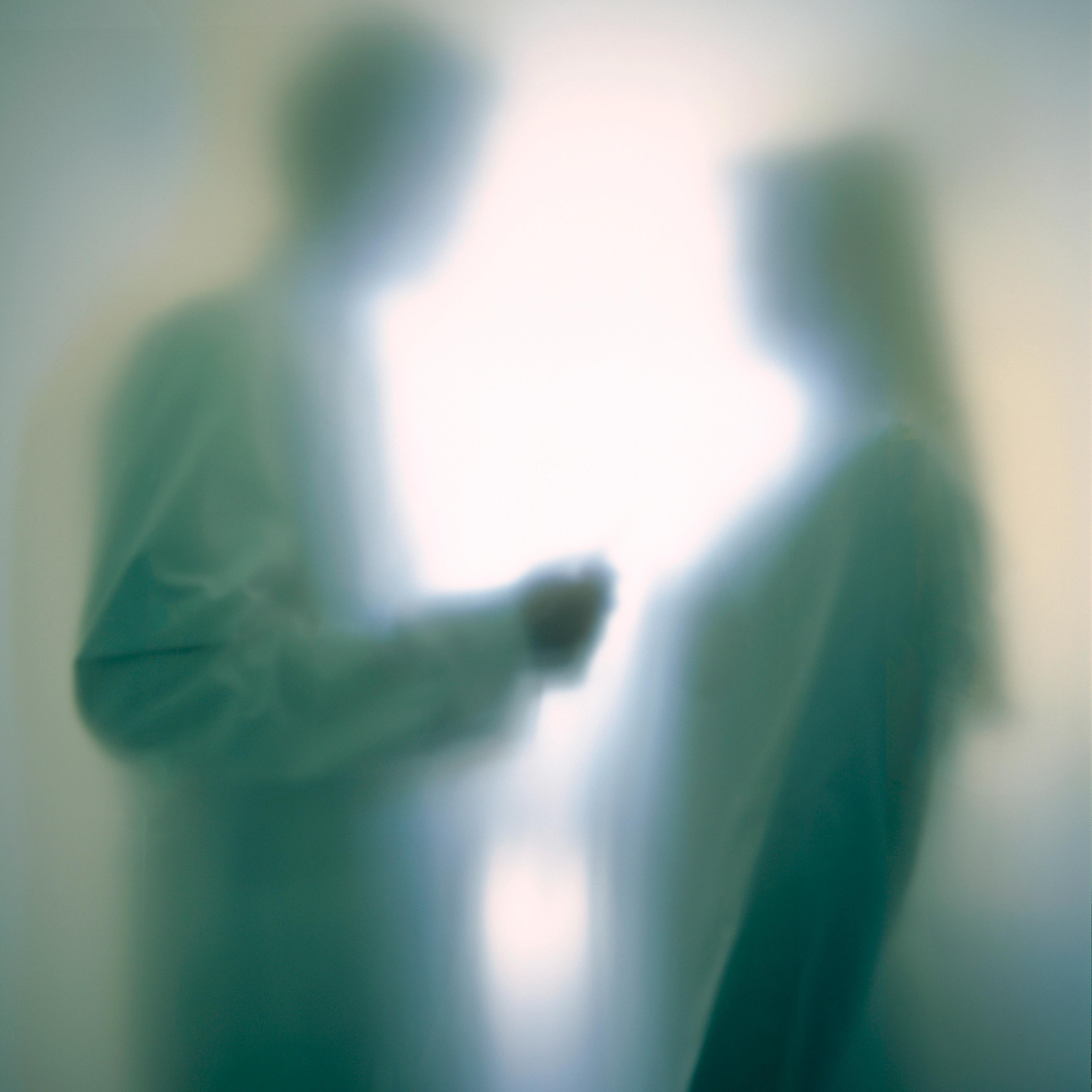 Doctor talking to patient, soft focus