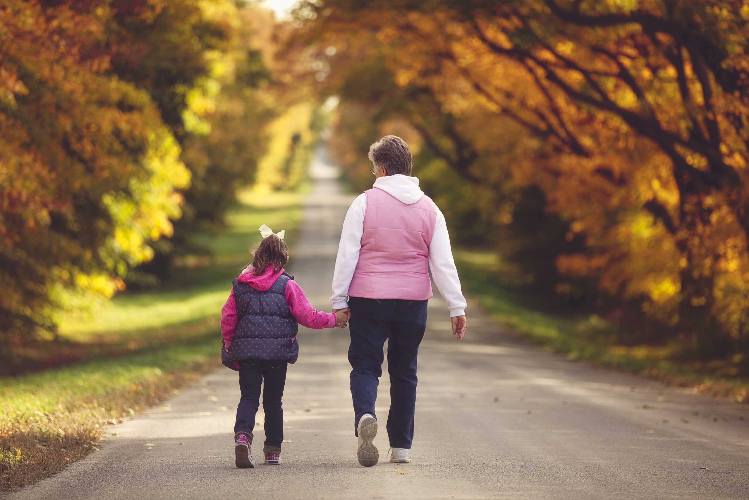 Grandmother and granddaughter walk