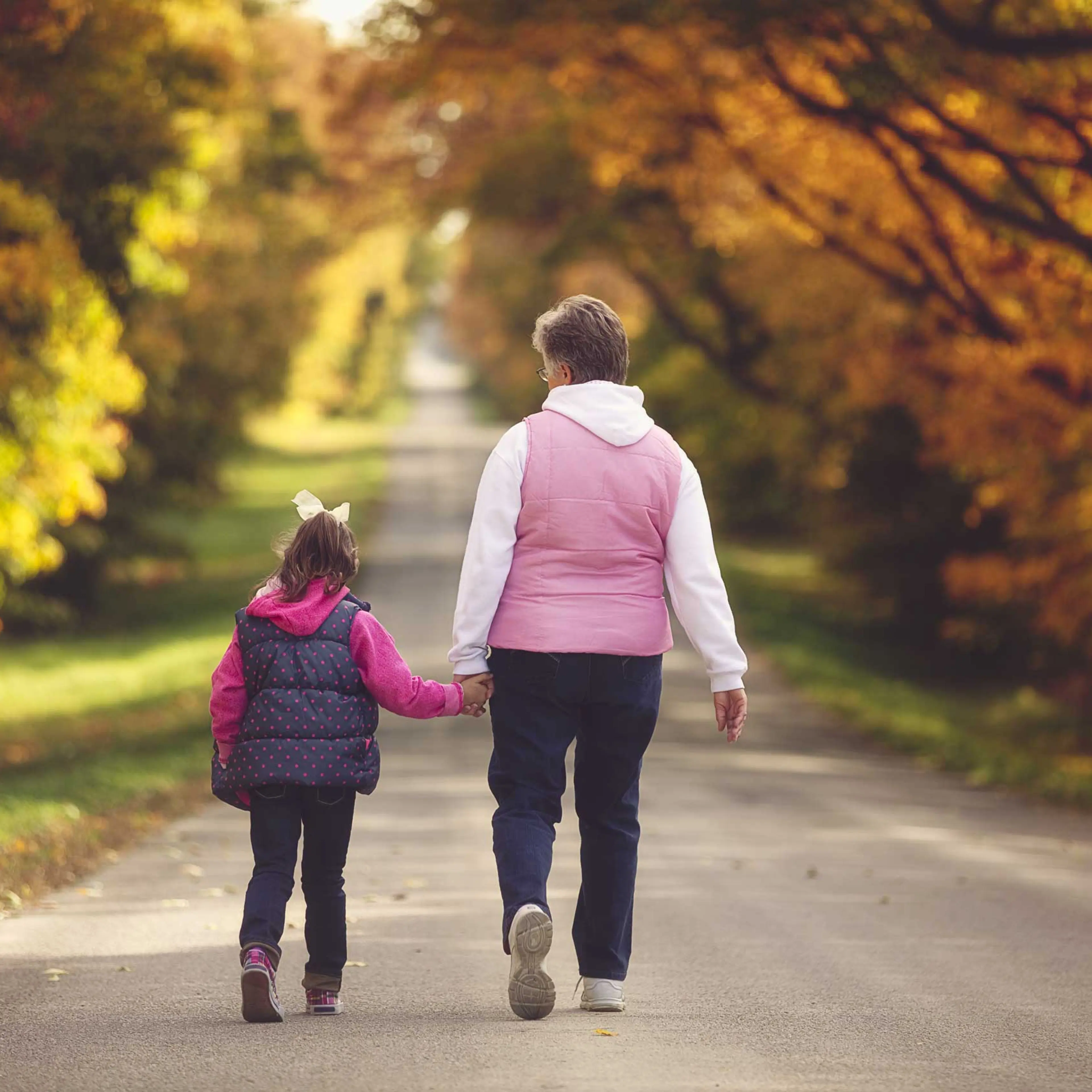 Grandmother and granddaughter walk