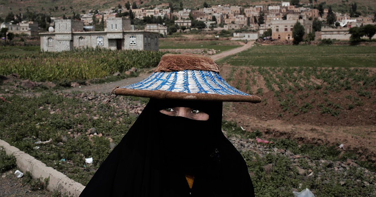 A woman walks through Ibb, south of Sana'a, on Aug. 3.
