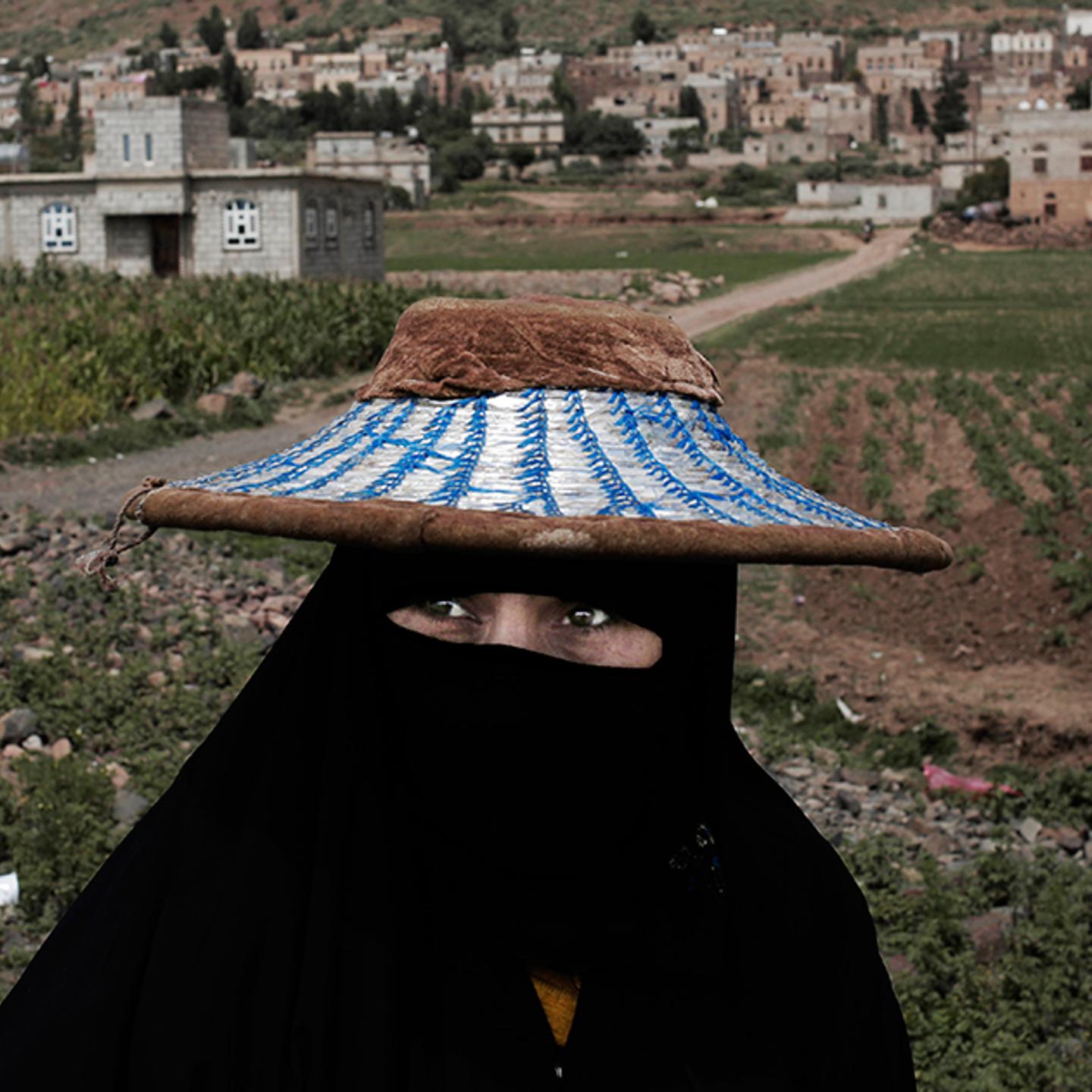 A woman walks through Ibb, south of Sana'a, on Aug. 3.