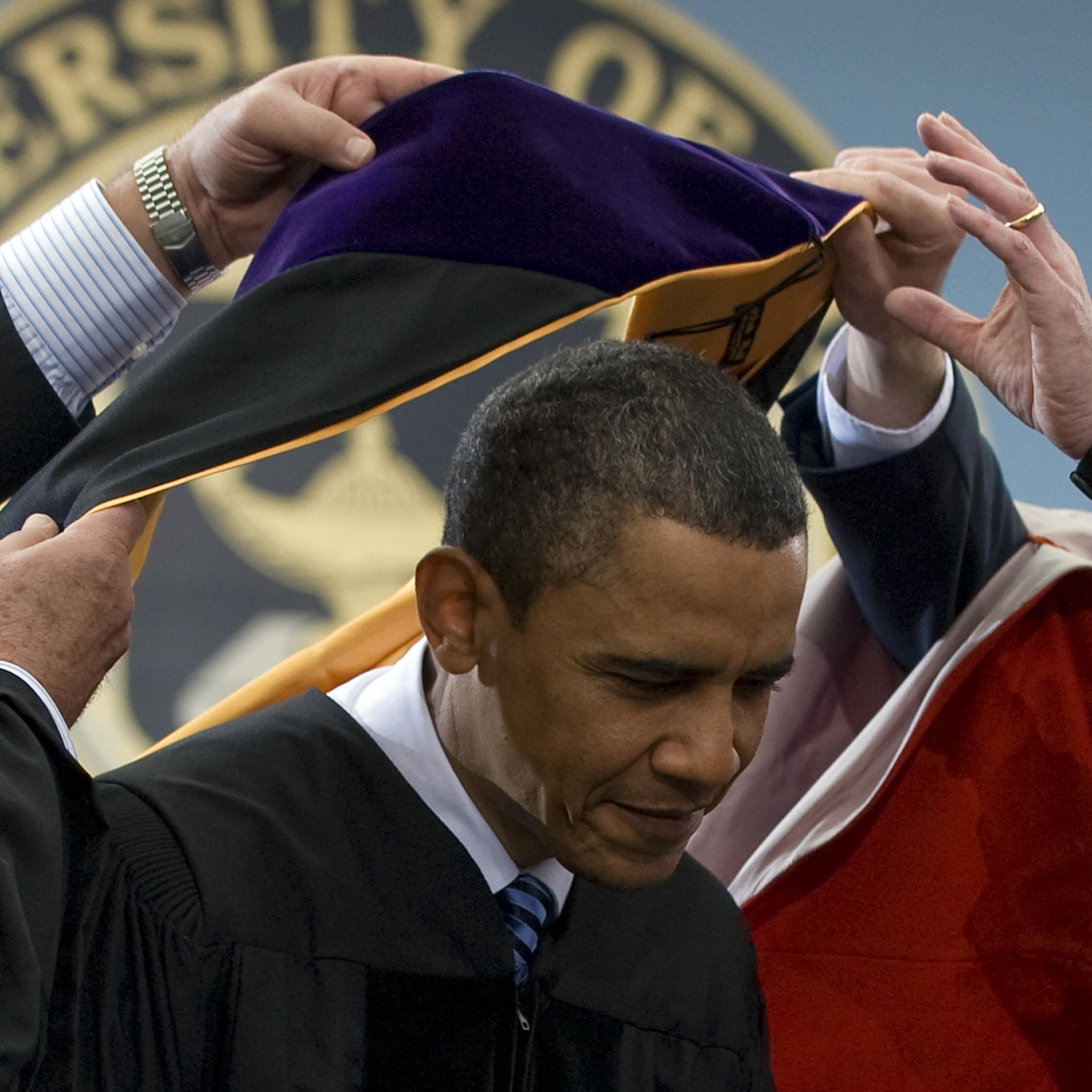 US President Barack Obama (C) recieves t