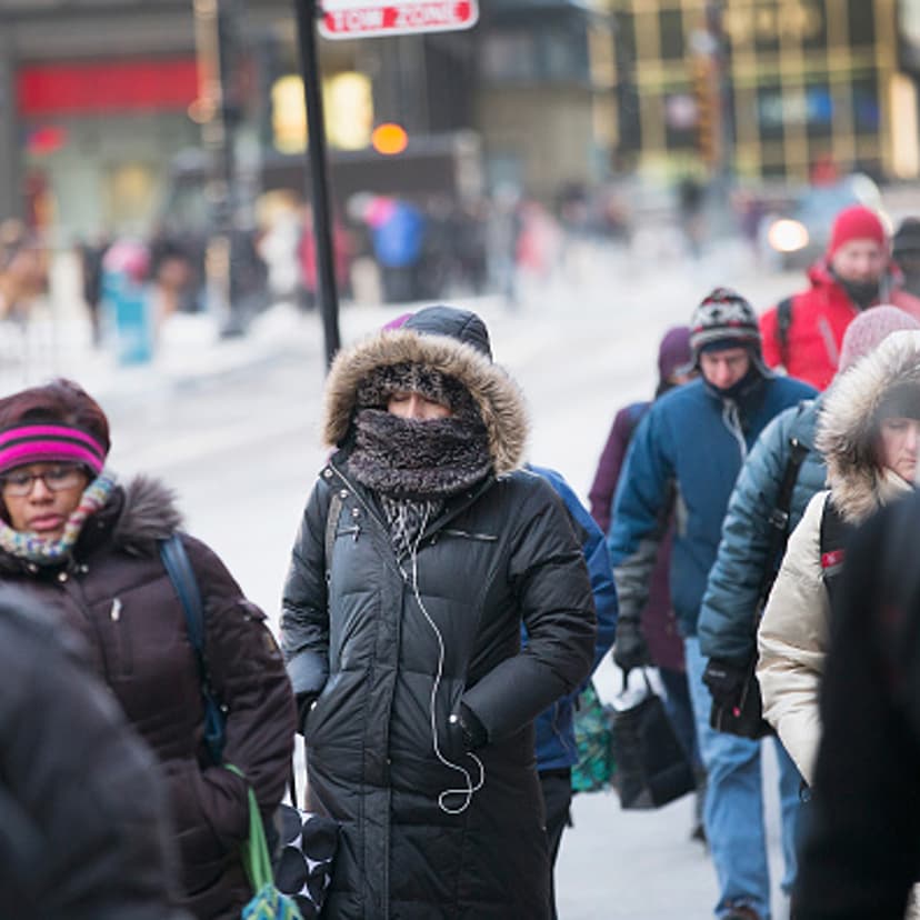 Commuters make their way to work as temperatures hovered around zero degrees Fahrenheit during the morning rush on January 5, 2015 in Chicago