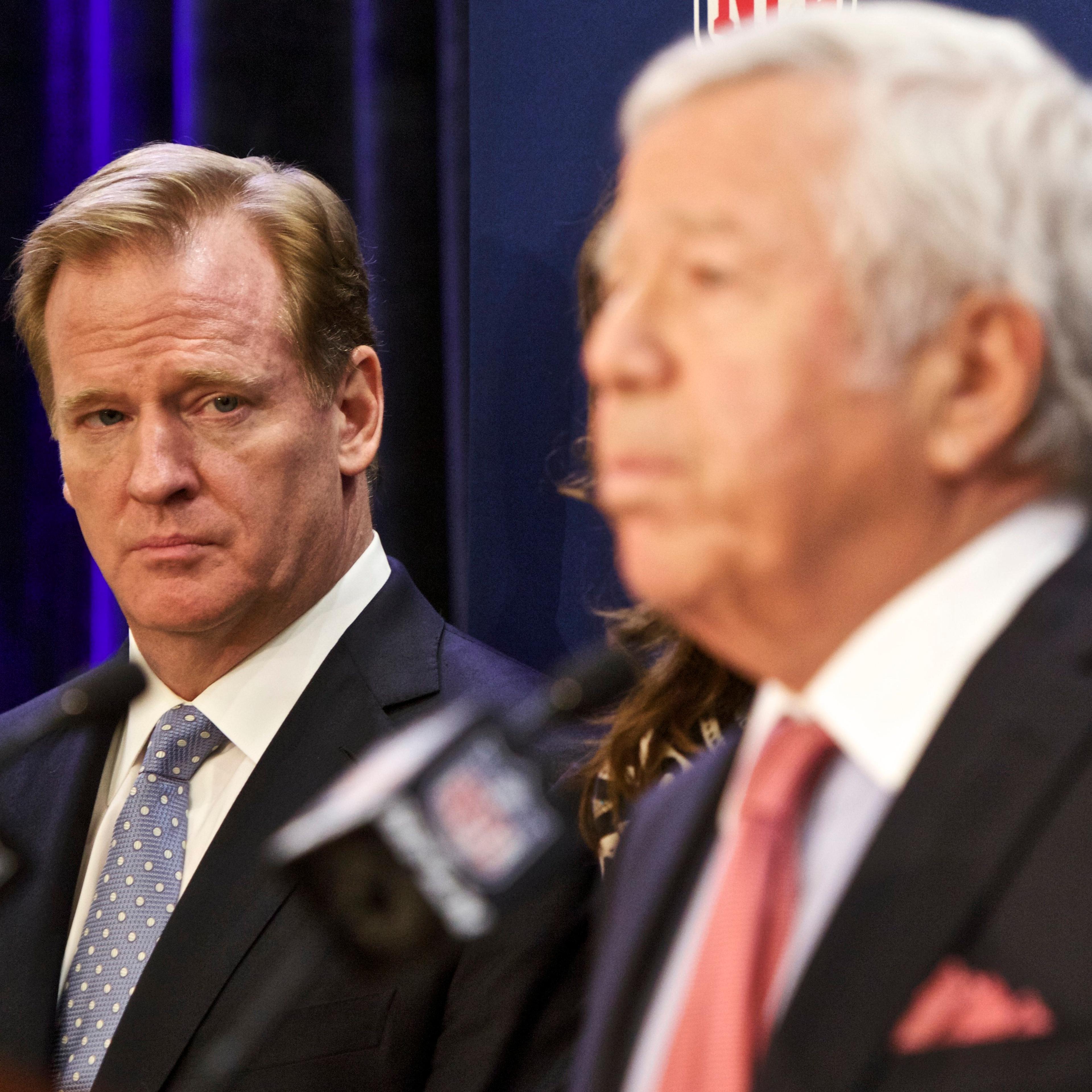 NFL commissioner Roger Goodell looks on as New England Patriots owner Robert Kraft speaks at an NFL press conference announcing new measures for the league's personal conduct policy during an owners meeting on Dec. 10, 2014, in Irving, Texas.