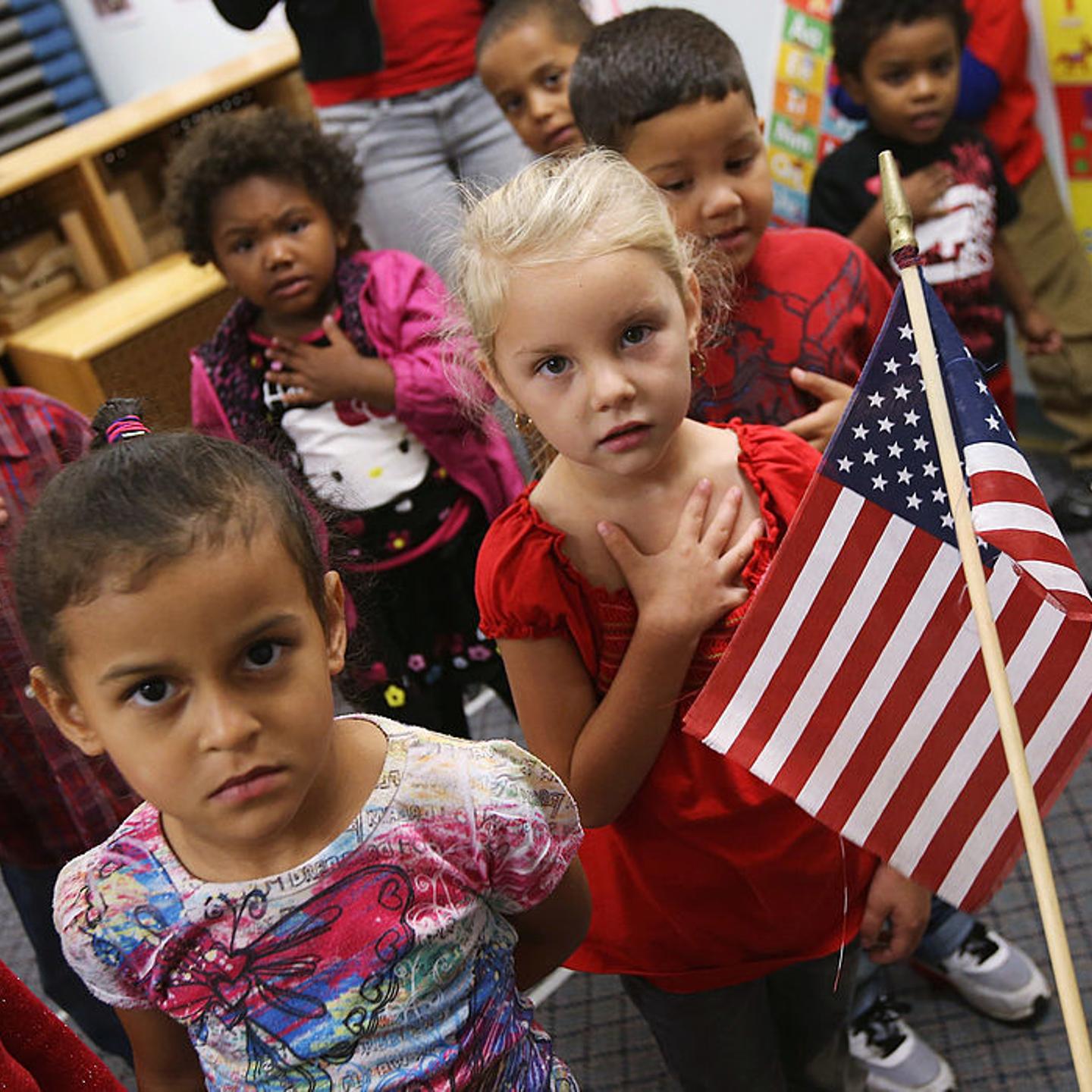 Children recite the Pledge of Allegiance at the beginning of the school day at the federally-funded Head Start school in Woodbourne, N.Y., on Sept. 20, 2012.