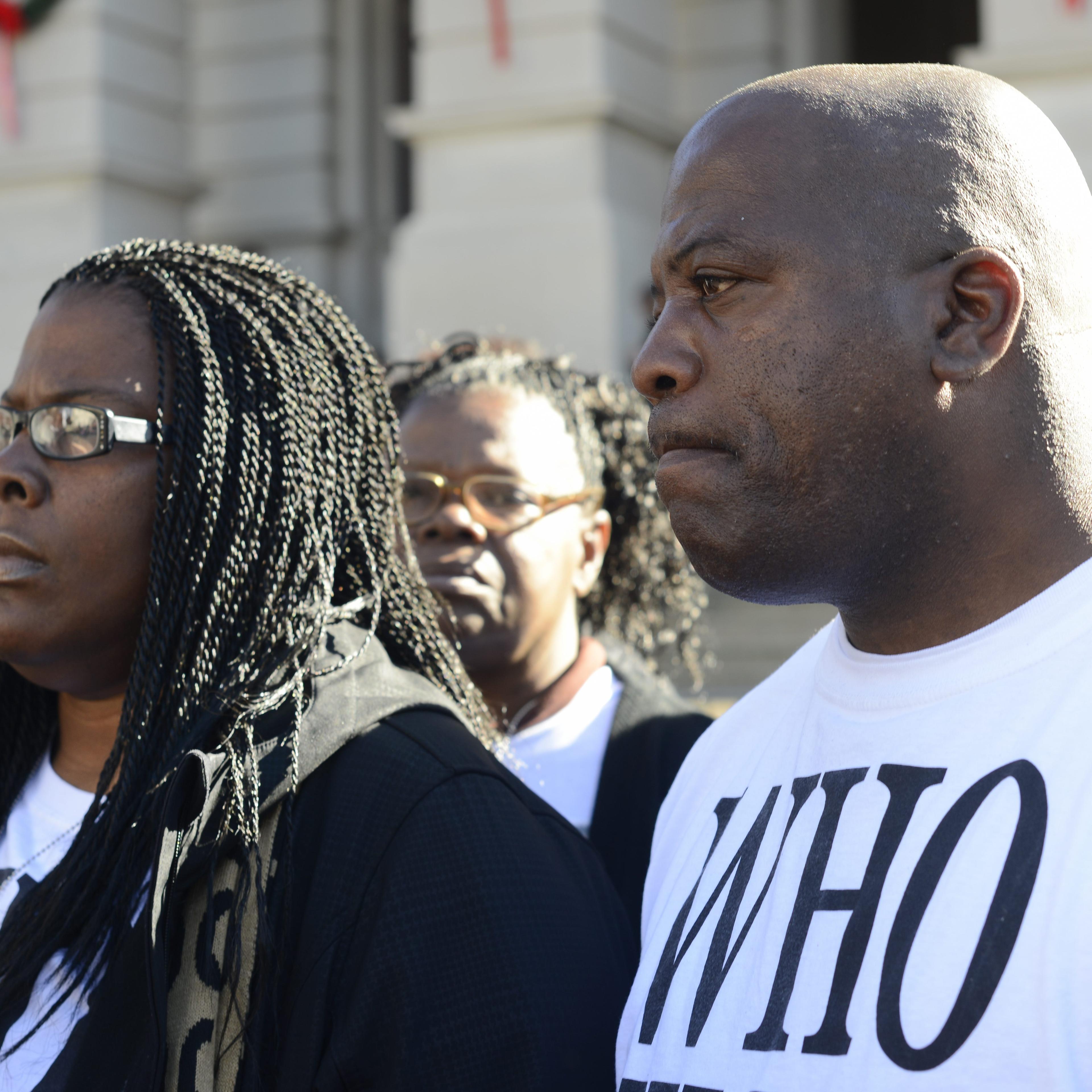 Jacqueline Johnson (left) and her husband Kenneth (right) participate in a rally on behalf of their dead son Kendrick Johnson at the Georgia State Capitol in Atlanta on Dec. 11, 2013.