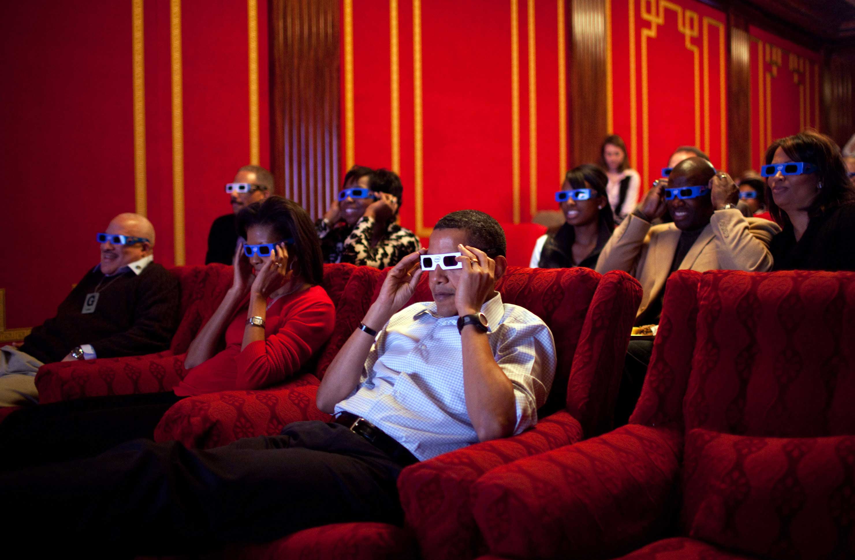 Feb. 1, 2009“During a Super Bowl watching party in the White House theatre, the President and First Lady join their guests in watching one of the TV commercials in 3D.” (Official White House photo by Pete Souza)This official White House photograph is bei