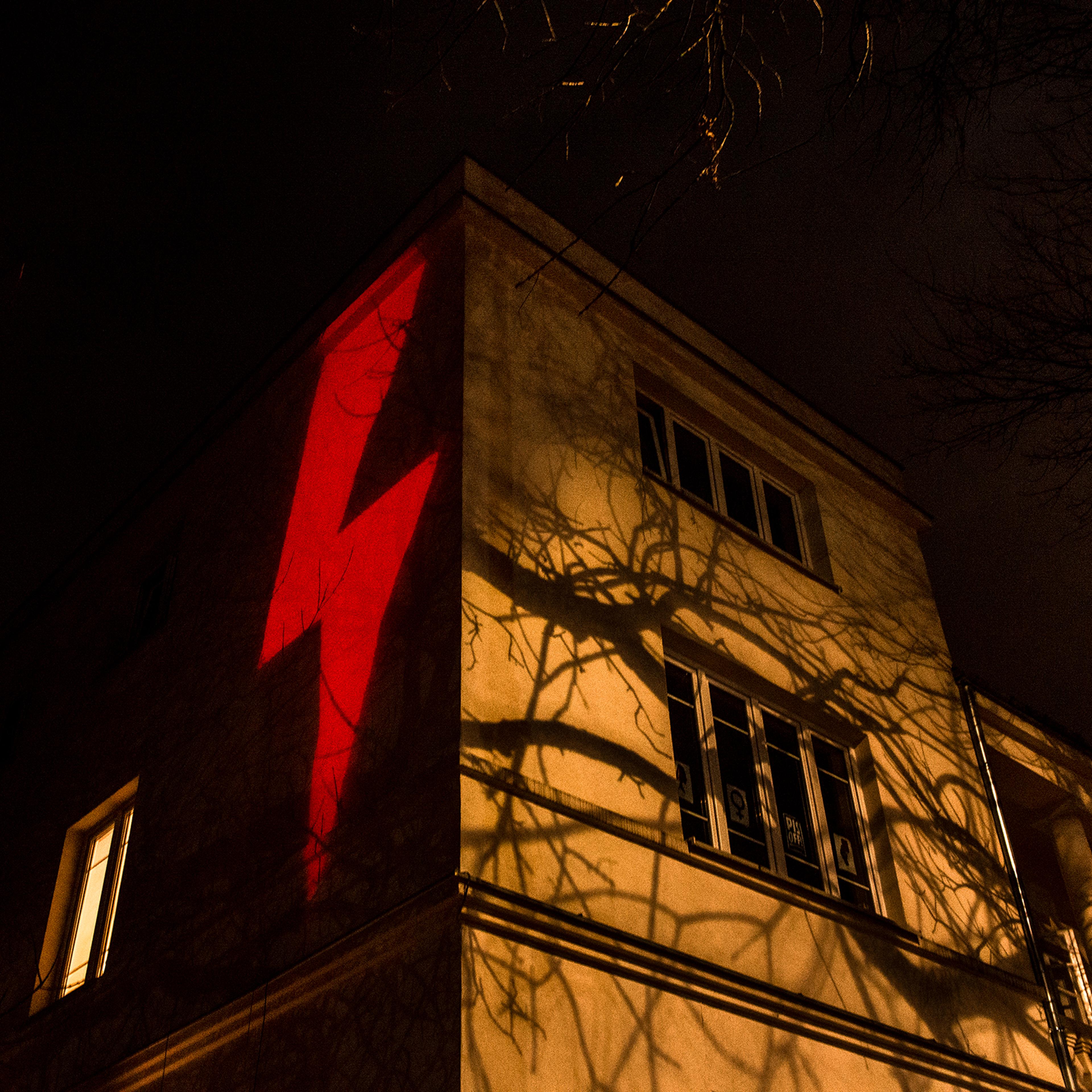 A red lightning bolt, the prominent symbol of recent protests against a Polish court's decision to effectively put a complete ban on abortion, is projected against a building in Warsaw on Oct. 30, 2020.