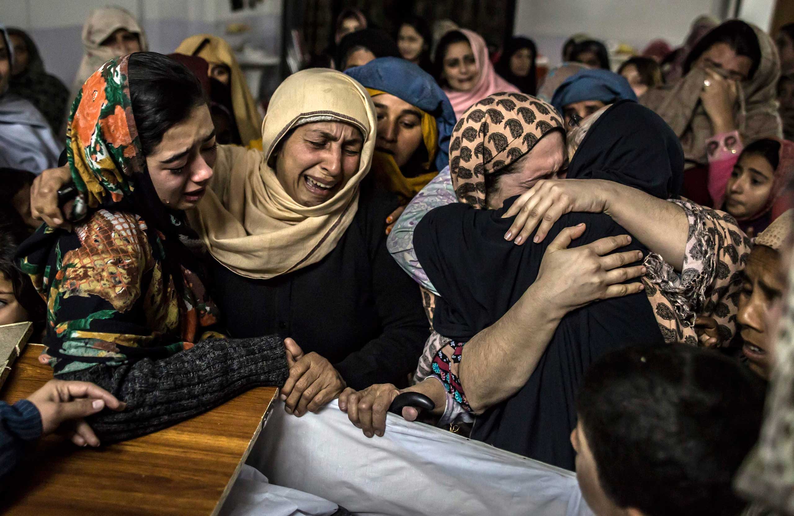 Women mourn their relative Mohammed Ali Khan, 15, a student who was killed during an attack by Pakistani Taliban gunmen on the Army Public School, at his house in Peshawar in 2014.