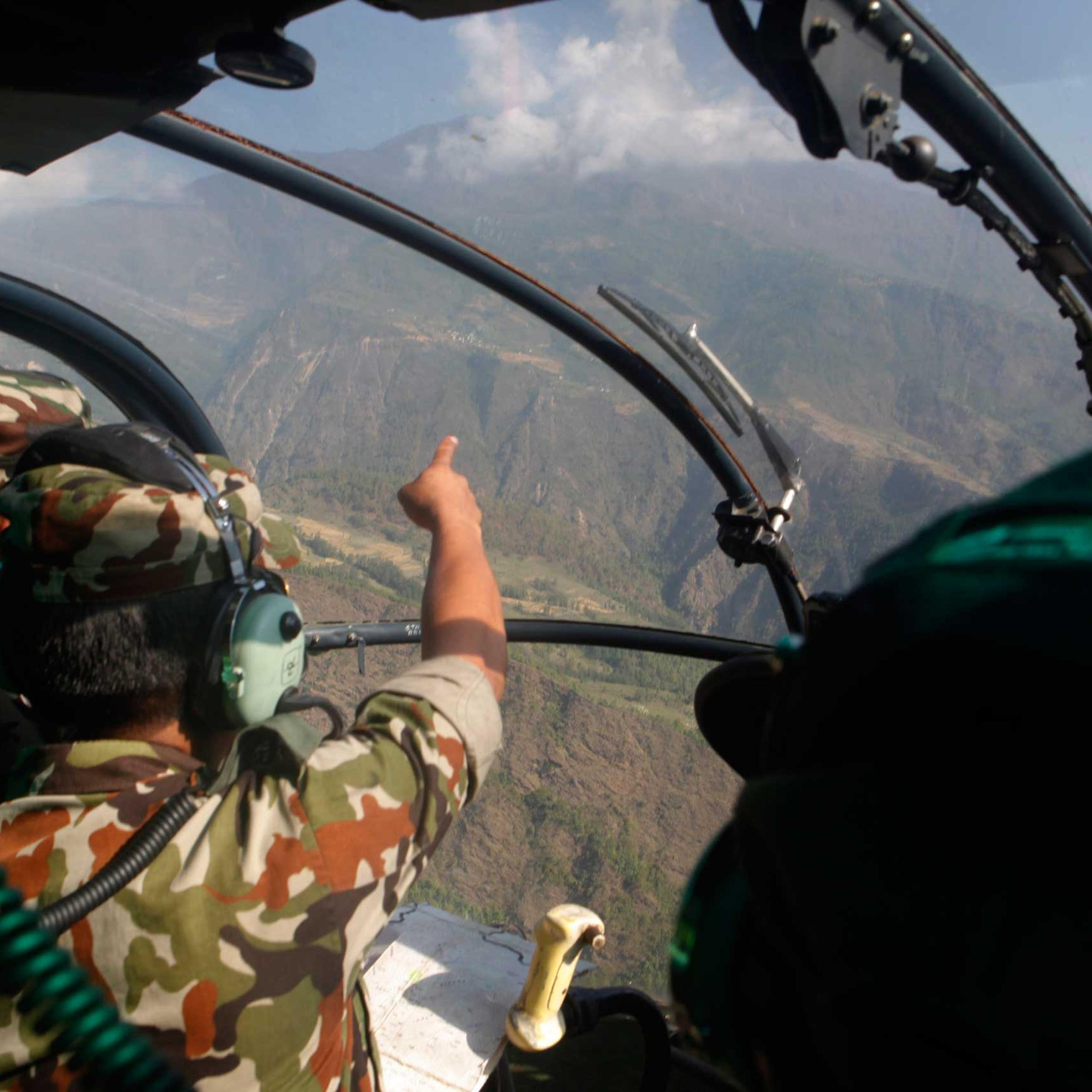 Nepalese army men search for the missing U.S. Marine helicopter in the earthquake affected Dolakha District of Nepal on May 14, 2015.
