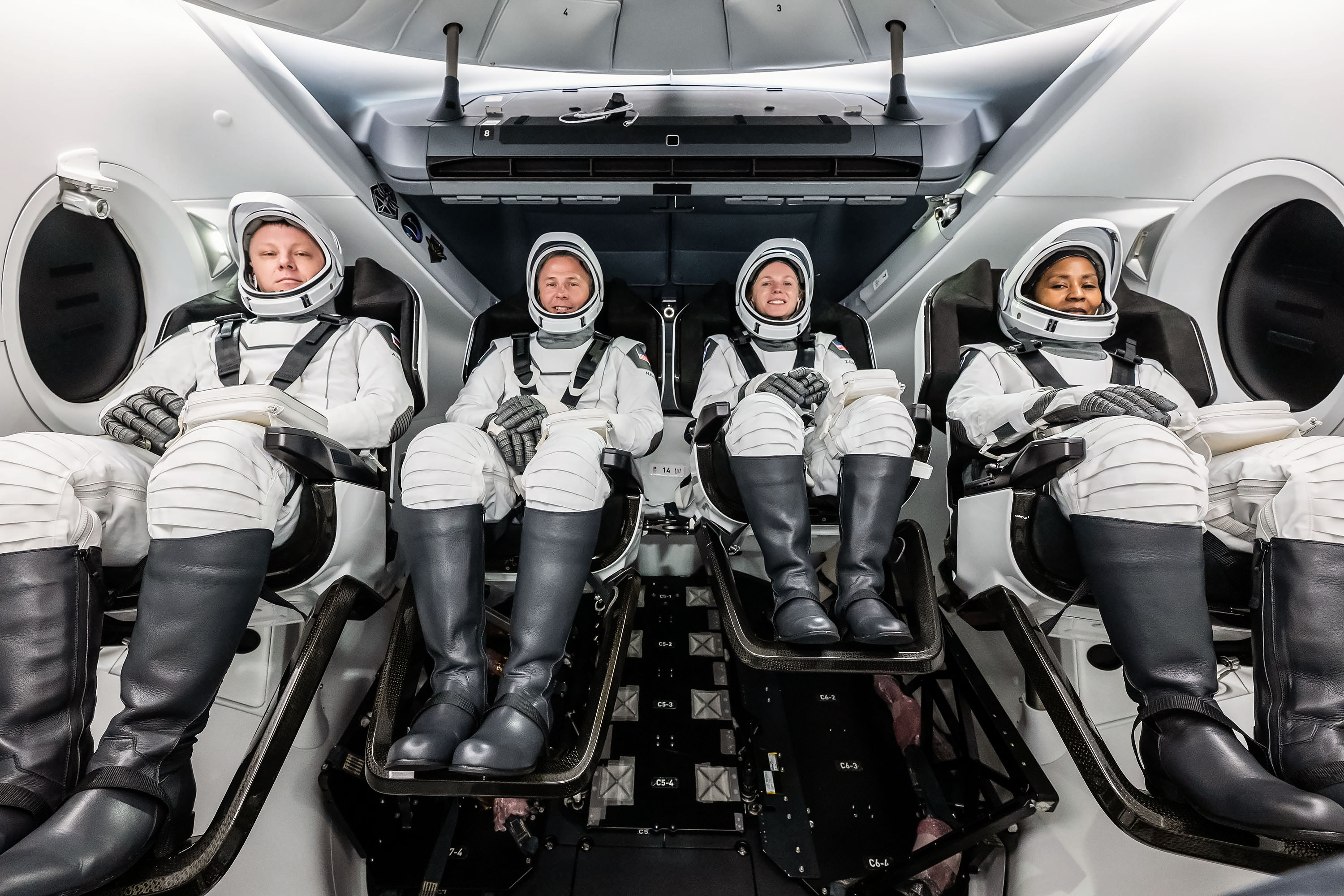 jsc2024e052322 - The crew of NASA’s SpaceX Crew-9 mission to the International Space Station poses for a photo during a crew equipment interface test (CEIT), which plays an important role in familiarizing crew members with the interior of the Dragon