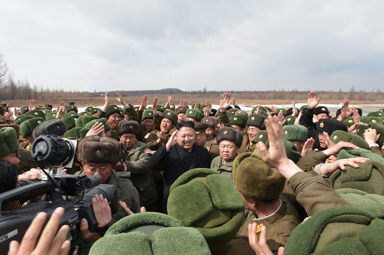 North Korean leader Kim Jong Un smiles as he greets commanding officers of the combined units of the Korean People's Army in this undated photo released by North Korea's Korean Central News Agency in Pyongyang, April 2, 2014.