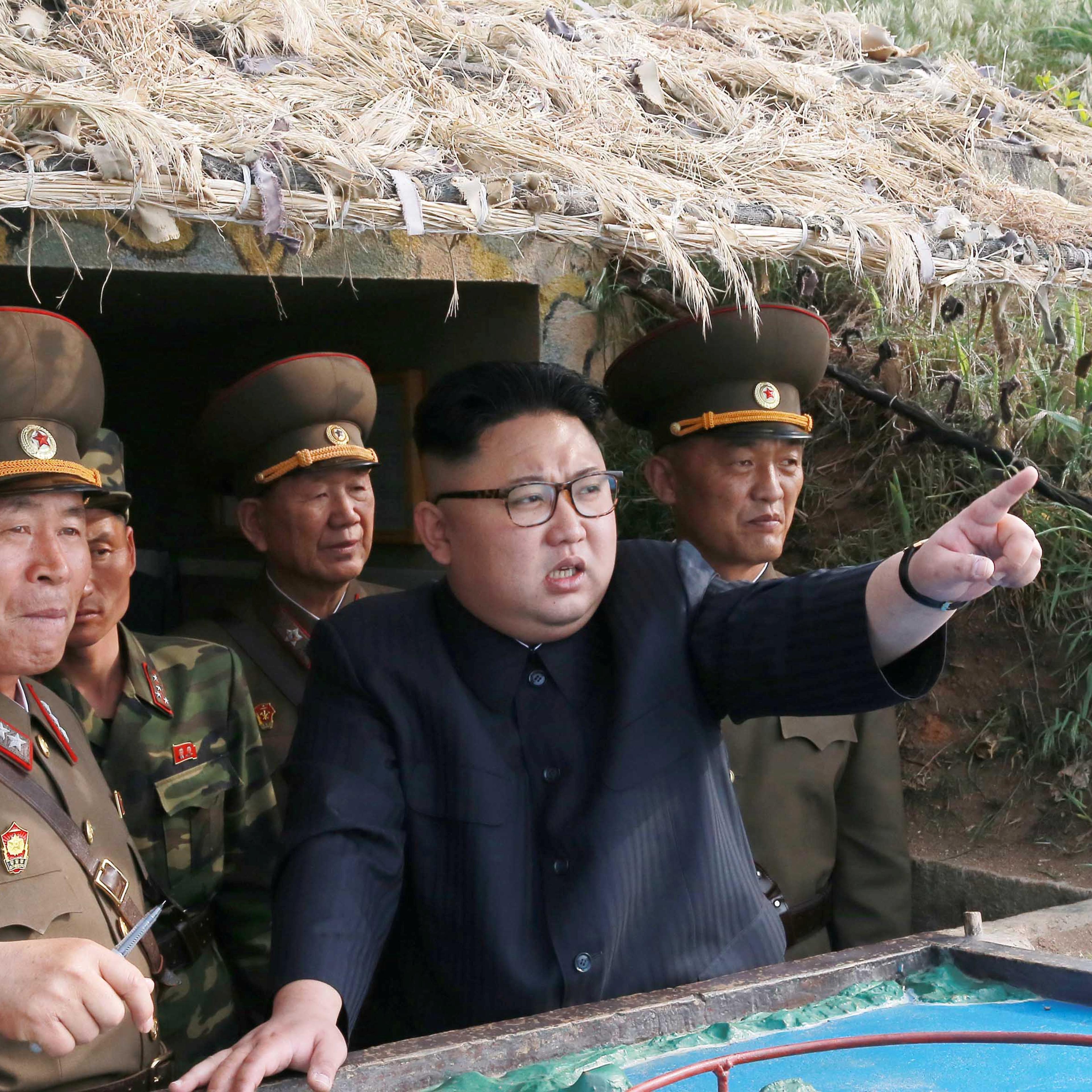 North Korean leader Kim Jong Un inspects the defence detachment on Jangjae Islet and the Hero Defence Detachment on Mu Islet located in the southernmost part of the waters off the southwest front, in this undated photo released by North Korea's KCNA