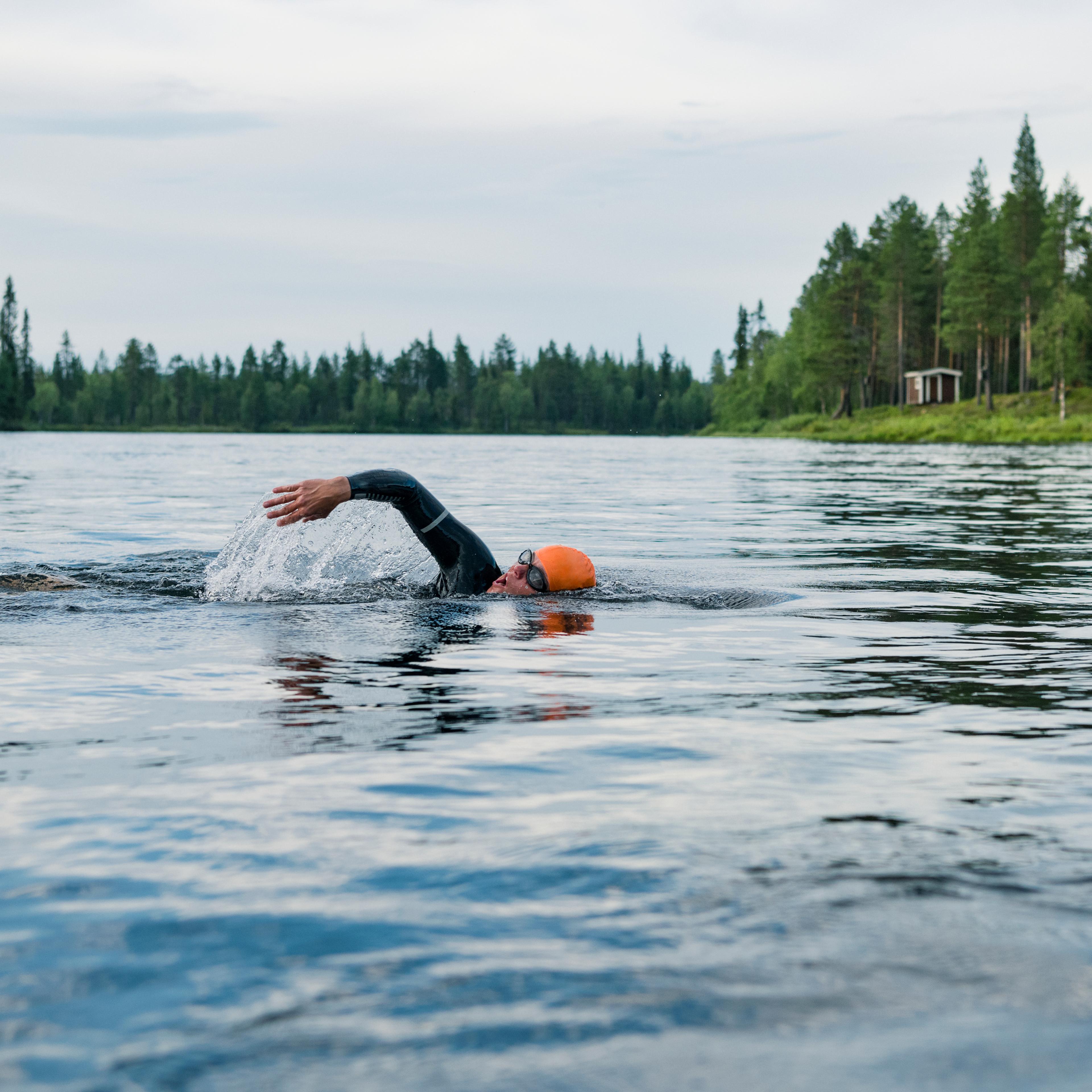 Person swimming in lake