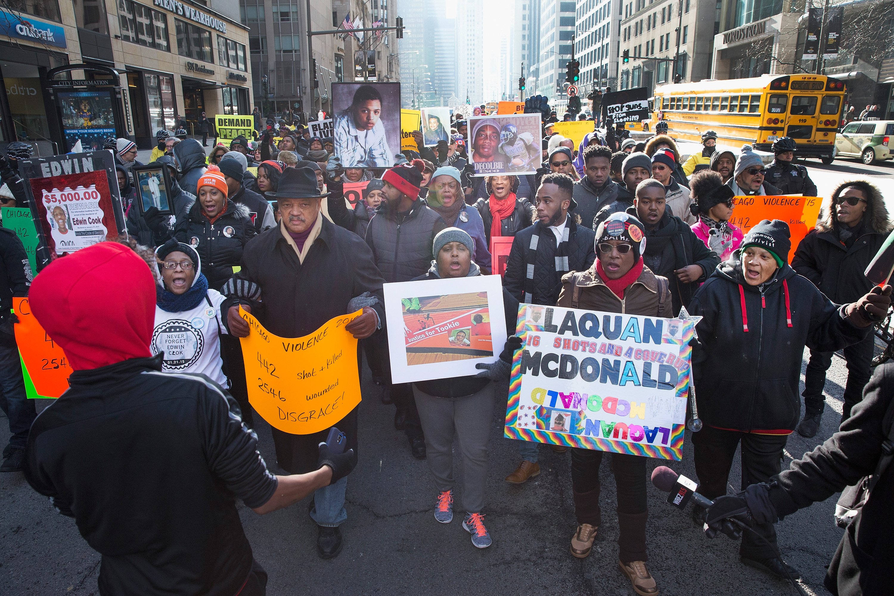 Rev. Jesse Jackson helps to lead demonstrators calling for an end to gun violence as they march through downtown Chicago on Dec. 31, 2015. The shooting deaths by police of a 19-year-old college student Quintonio LeGrier and his 55-year-old neighbor Betti