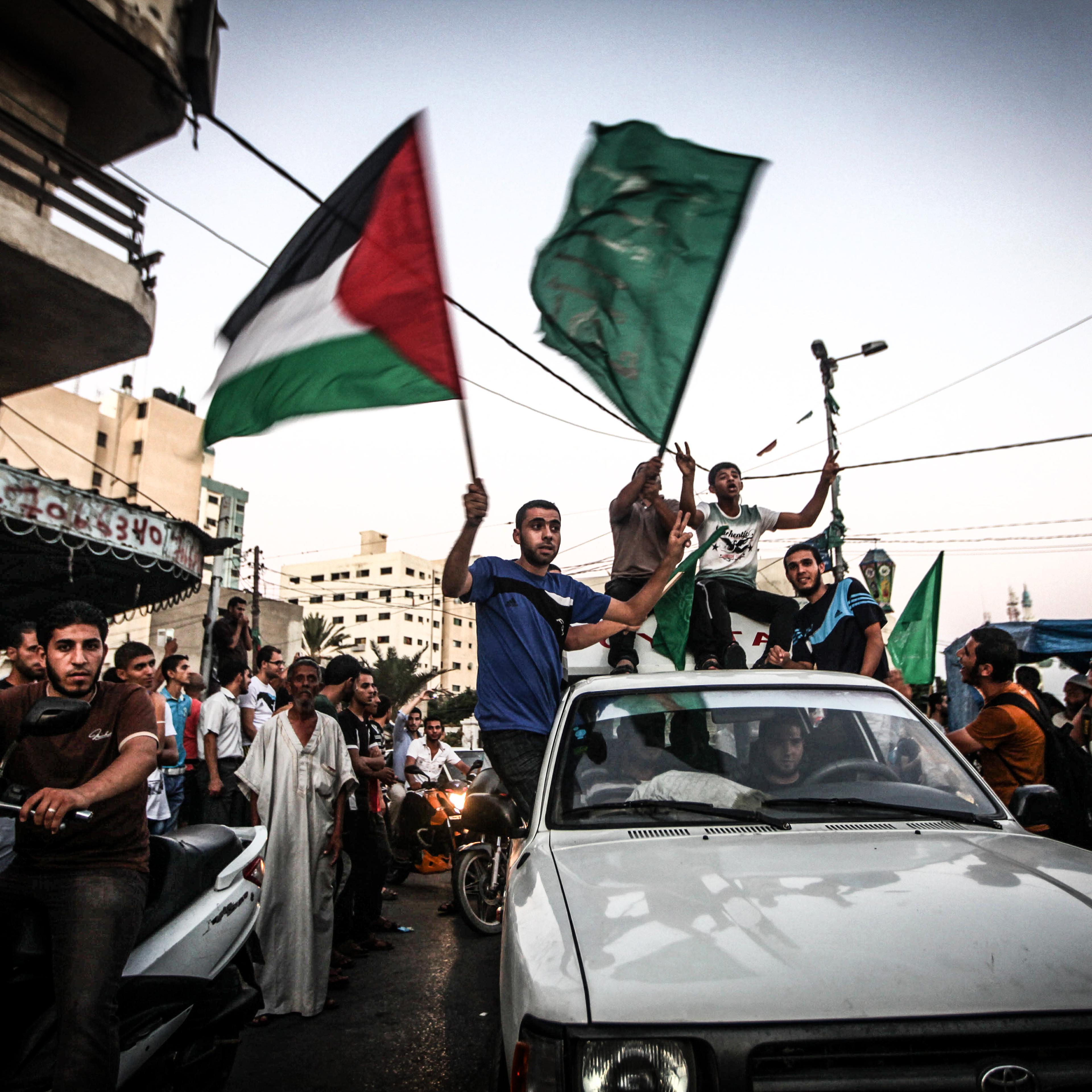 The sign of victory as people gather in the streets to celebrate after a deal had been reached between Hamas and Israel over a long-term end to seven weeks of fighting in the Gaza Strip on Aug. 26, 2014 in Gaza City.