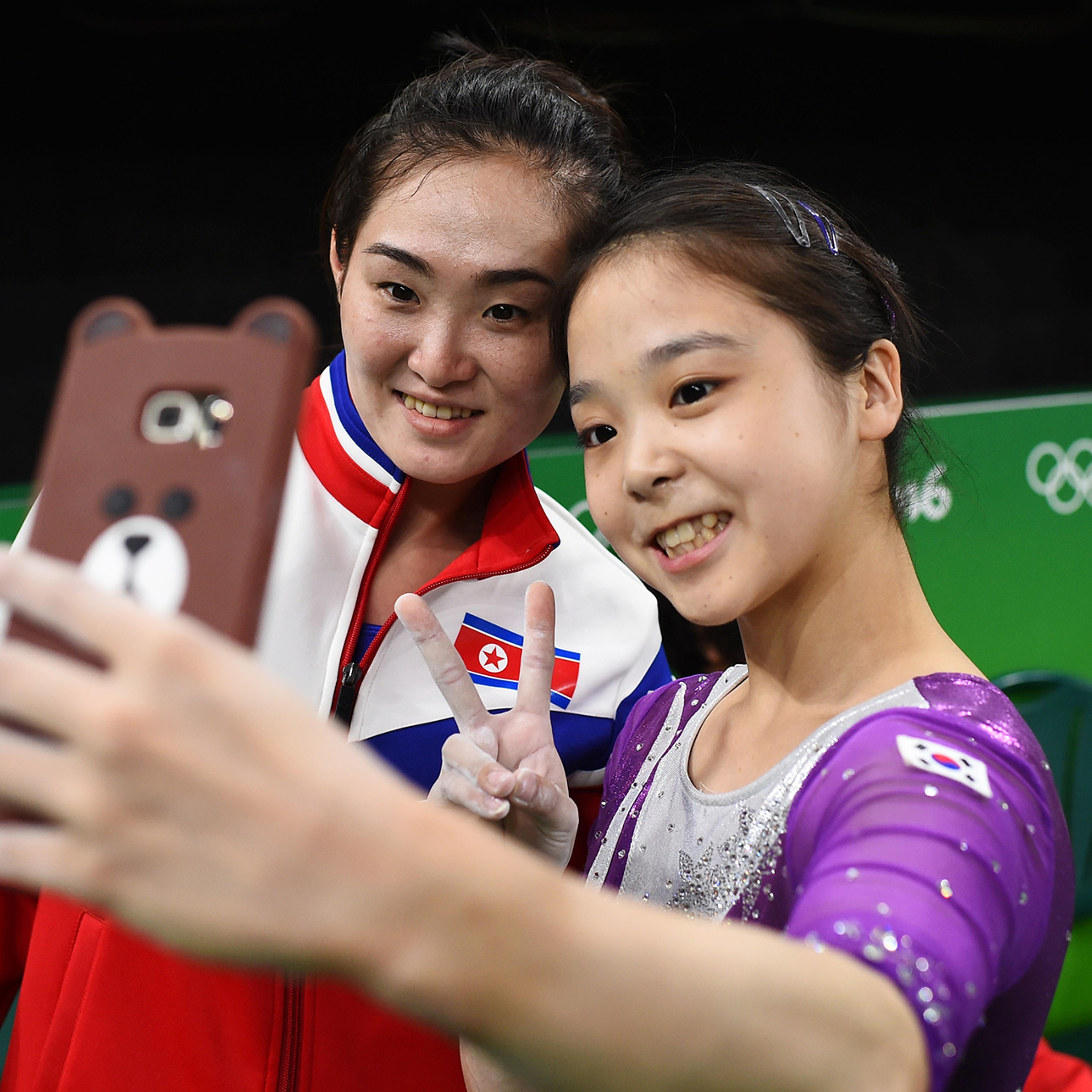 Lee Eun-Ju of South Korea, right, takes a selfie with Hong Un Jong of North Korea, left, on Aug. 4, 2016 in Rio de Janeiro, Brazil.