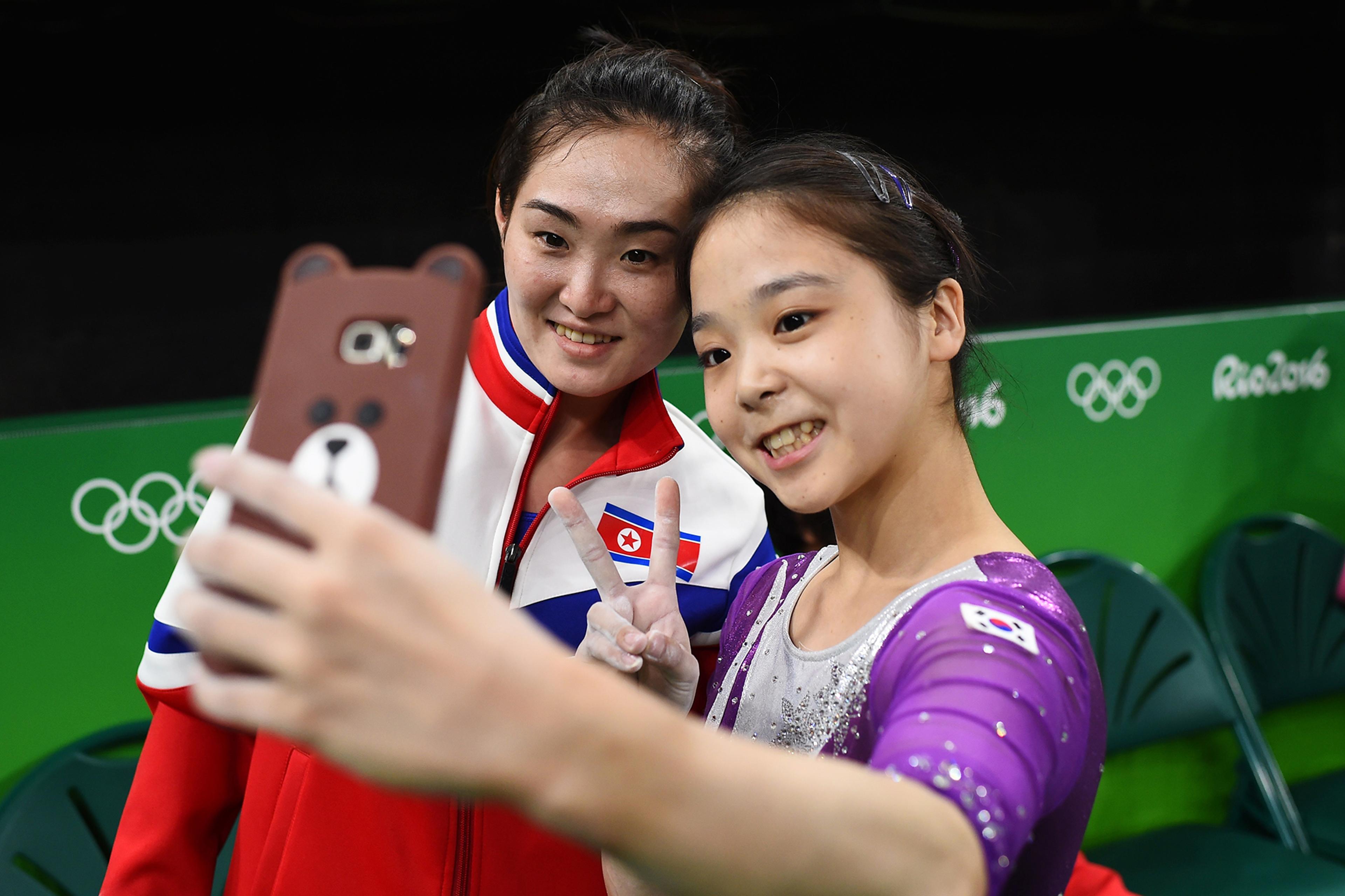 Lee Eun-Ju of South Korea, right, takes a selfie with Hong Un Jong of North Korea, left, on Aug. 4, 2016 in Rio de Janeiro, Brazil.