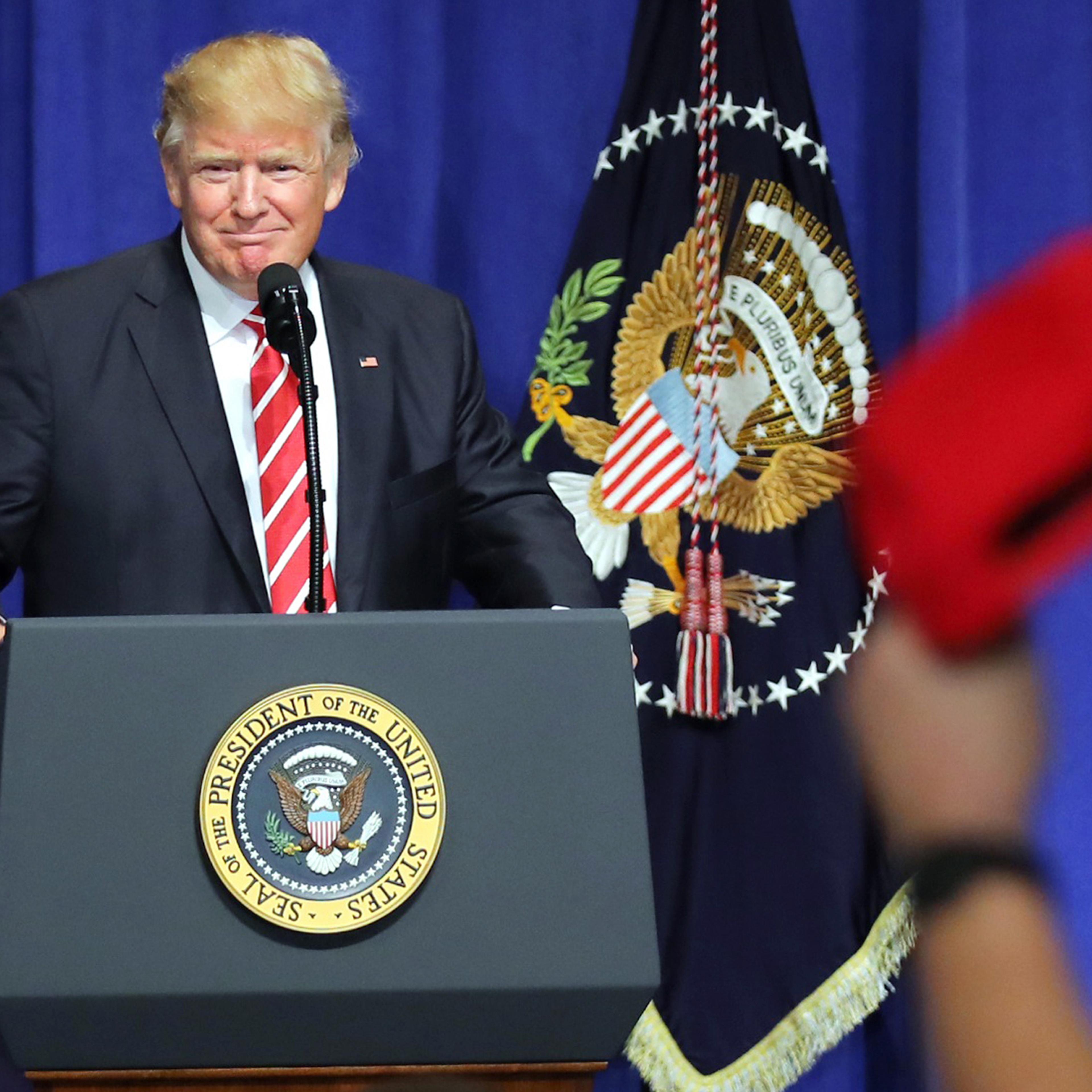 U.S. President Donald Trump is welcomed as he speaks to commanders and coalition representatives during a visit to U.S. Central Command and U.S. Special Operations Command at MacDill Air Force Base in Tampa, Florida, U.S., February 6, 2017. REUTERS/Carlo