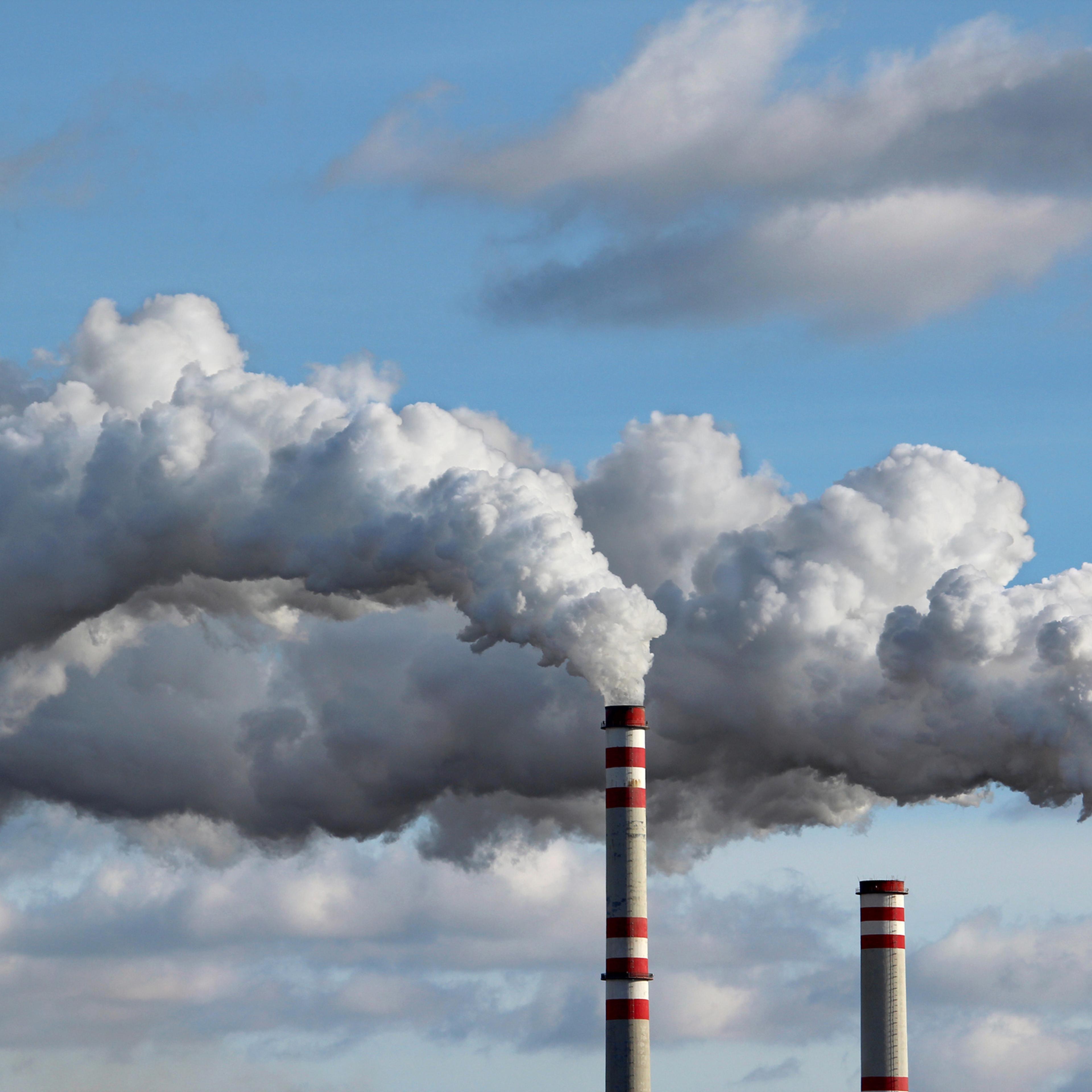 detail of white smoke polluted sky