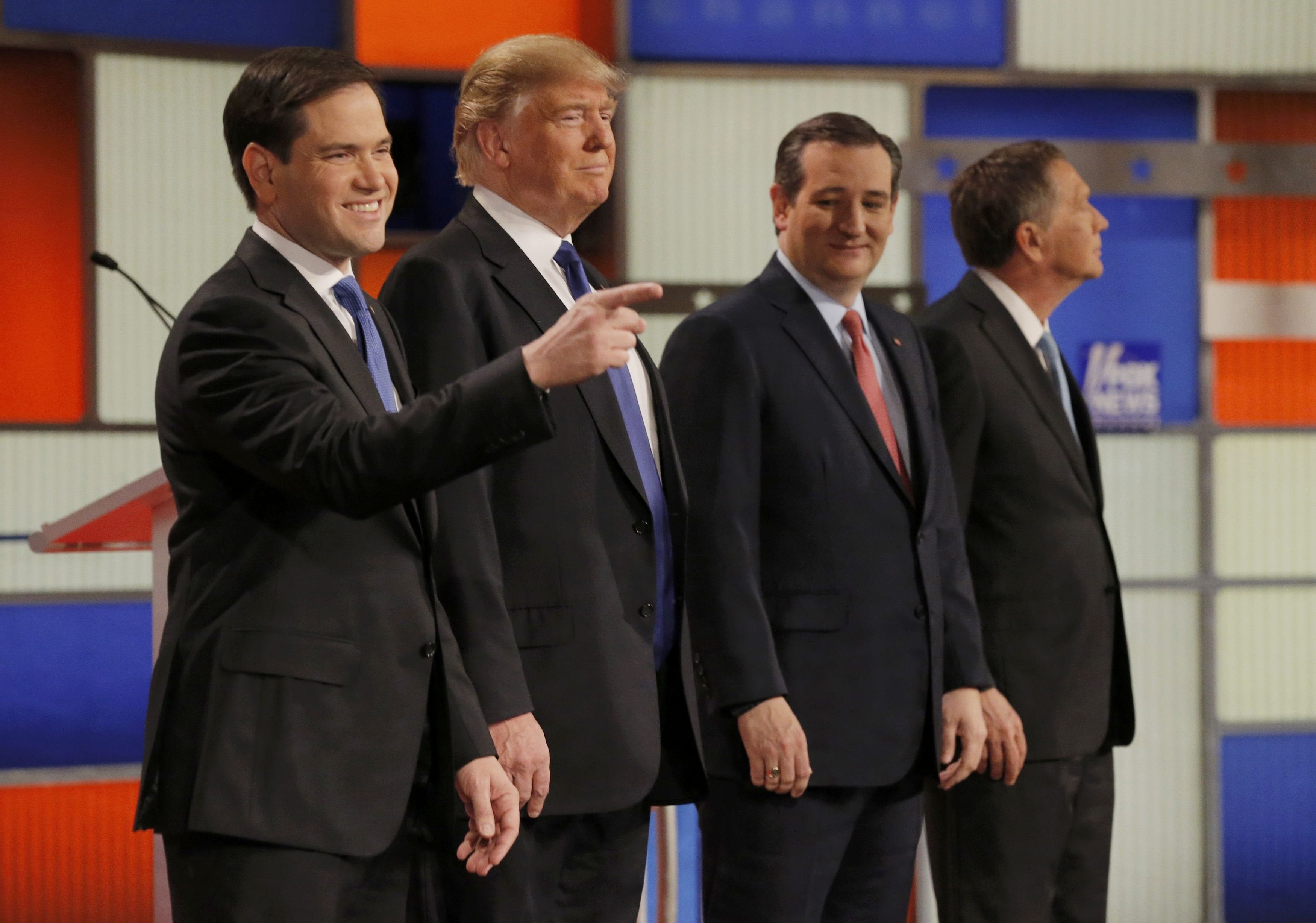 Republican U.S. presidential candidates Rubio, Trump, Cruz and Kasich pose together at the start of the U.S. Republican presidential candidates debate in Detroit,