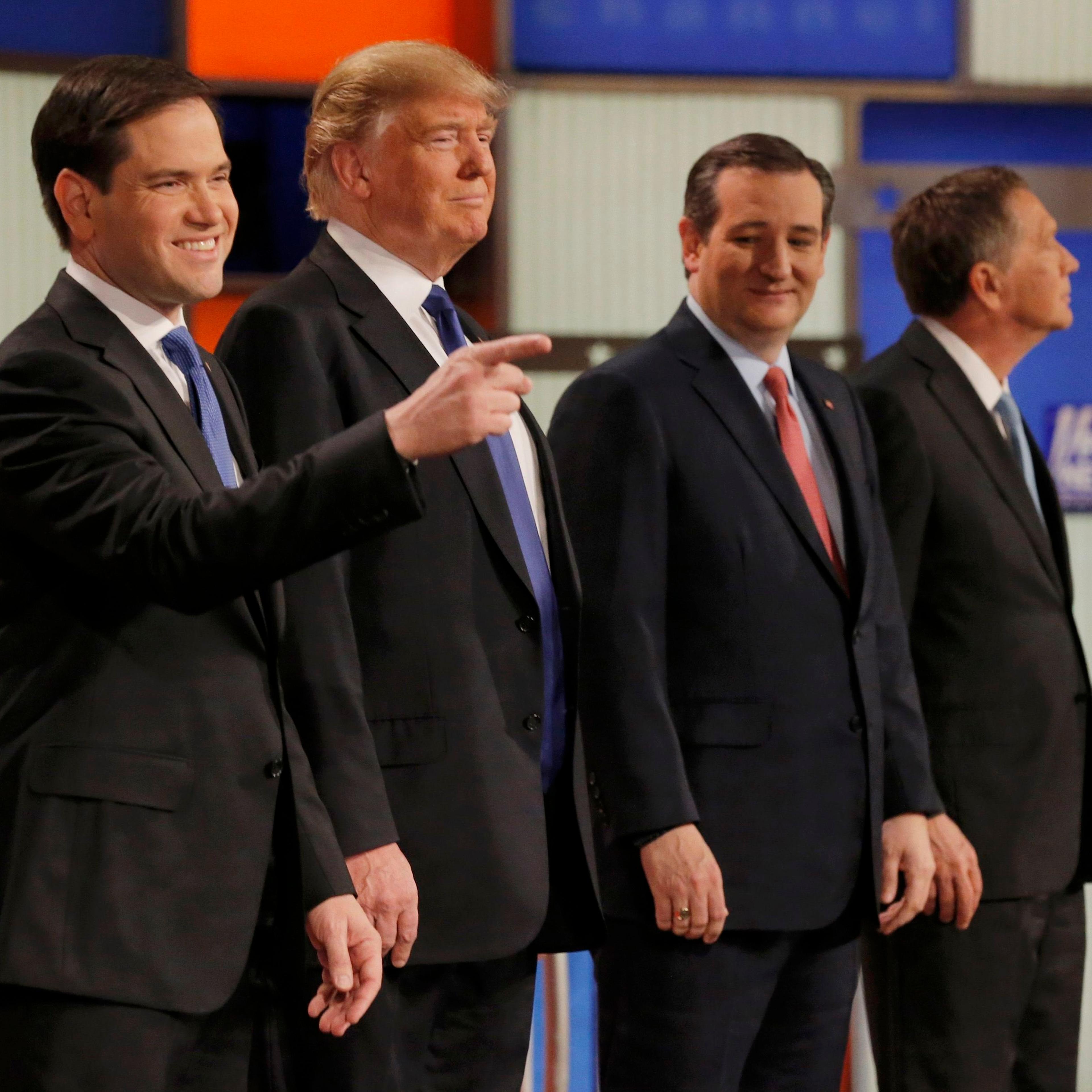 Republican U.S. presidential candidates Rubio, Trump, Cruz and Kasich pose together at the start of the U.S. Republican presidential candidates debate in Detroit,