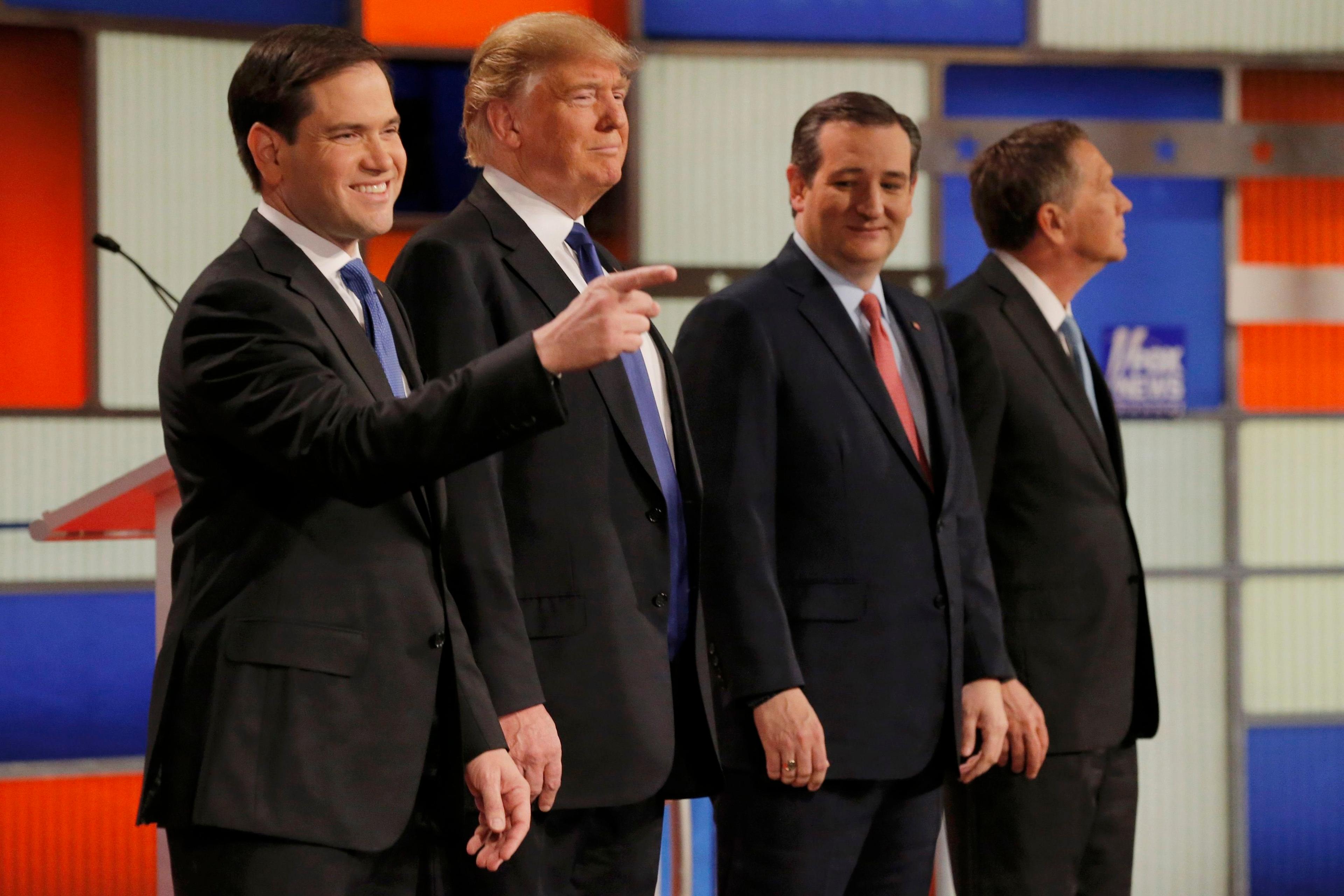 Republican U.S. presidential candidates Rubio, Trump, Cruz and Kasich pose together at the start of the U.S. Republican presidential candidates debate in Detroit,