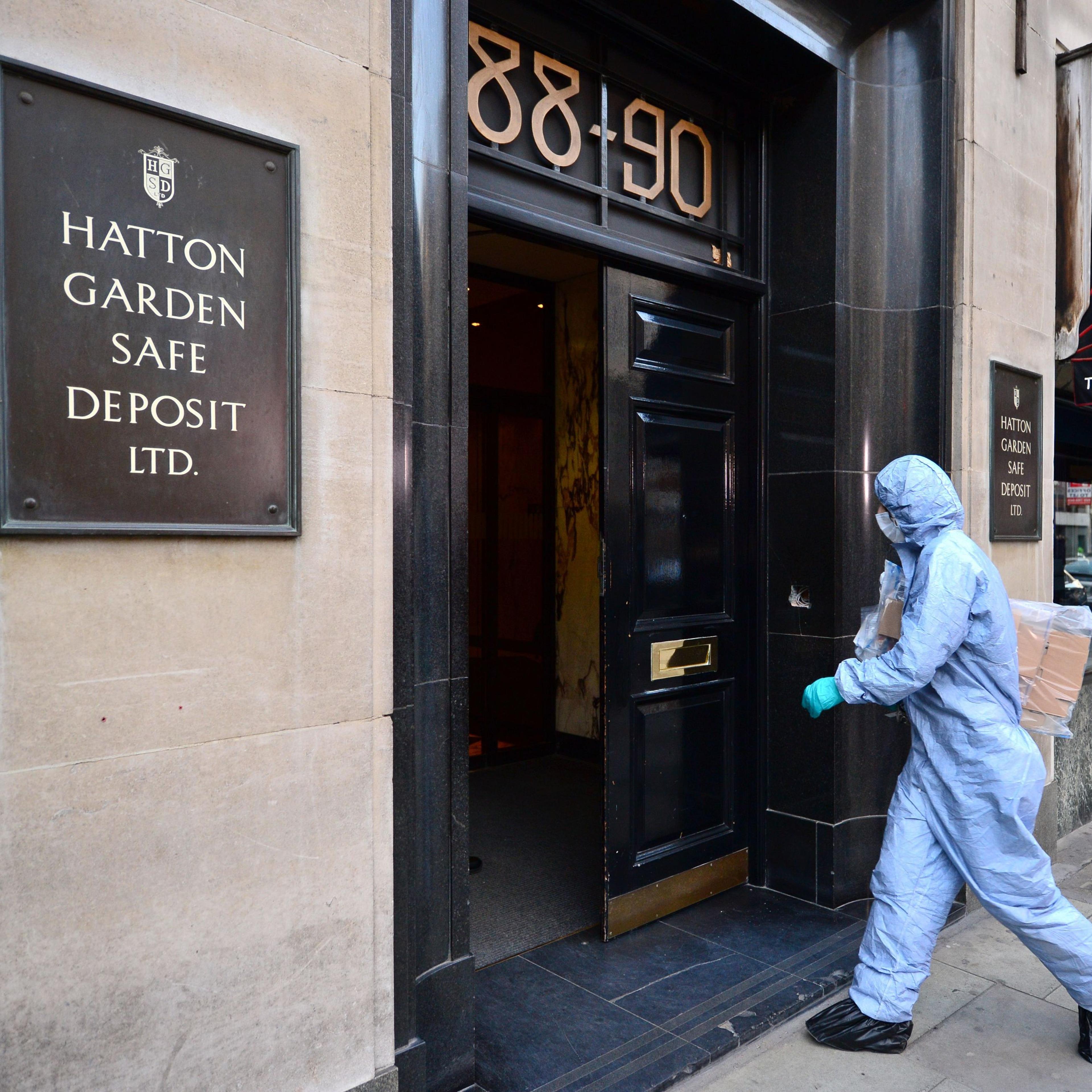 A police forensics officer enters the Hatton Garden Safe Deposit company in London Tuesday May 7, 2015 after it was burgled over the weekend.