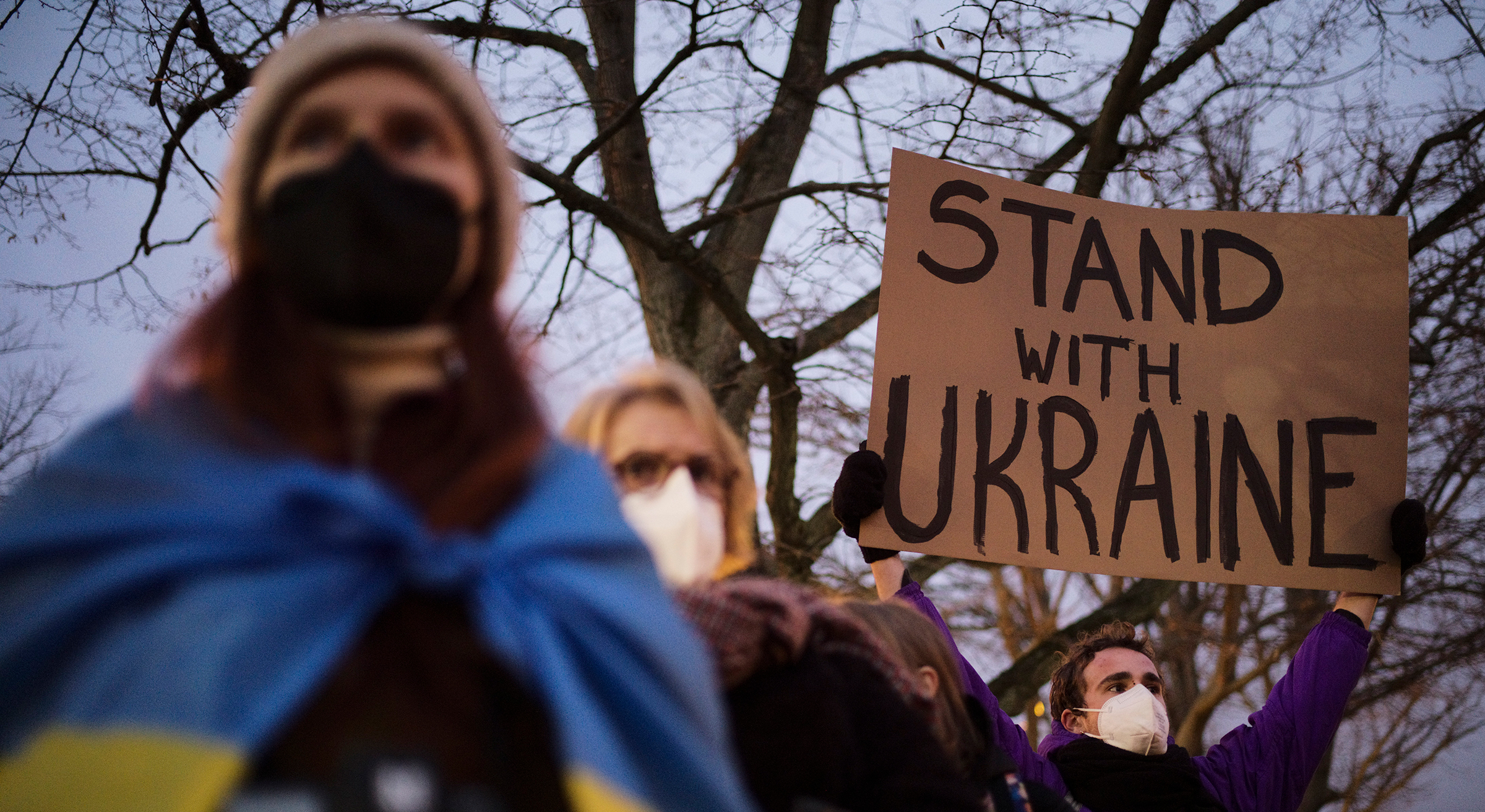 Demonstrators stand in support of Ukraine