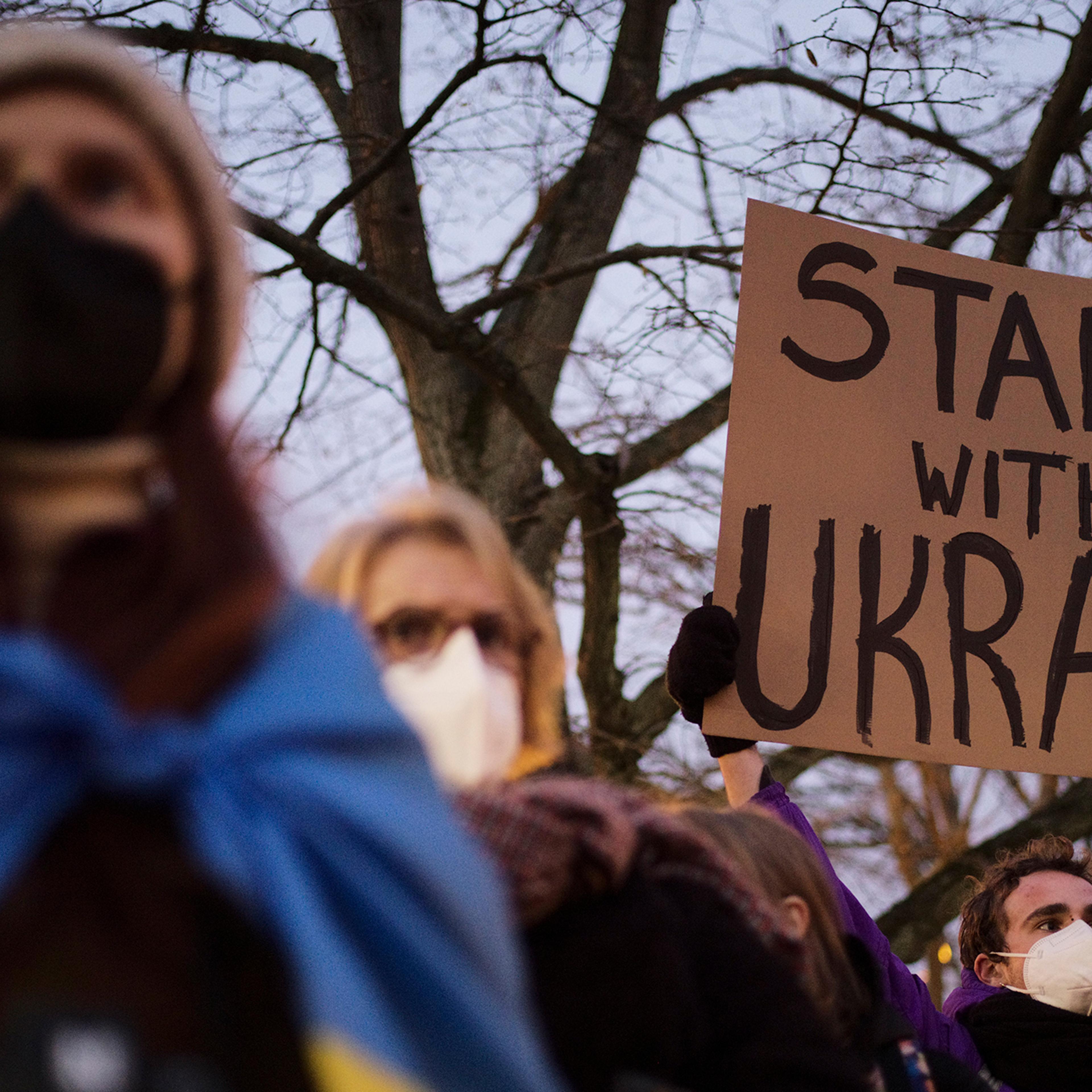 Demonstrators stand in support of Ukraine