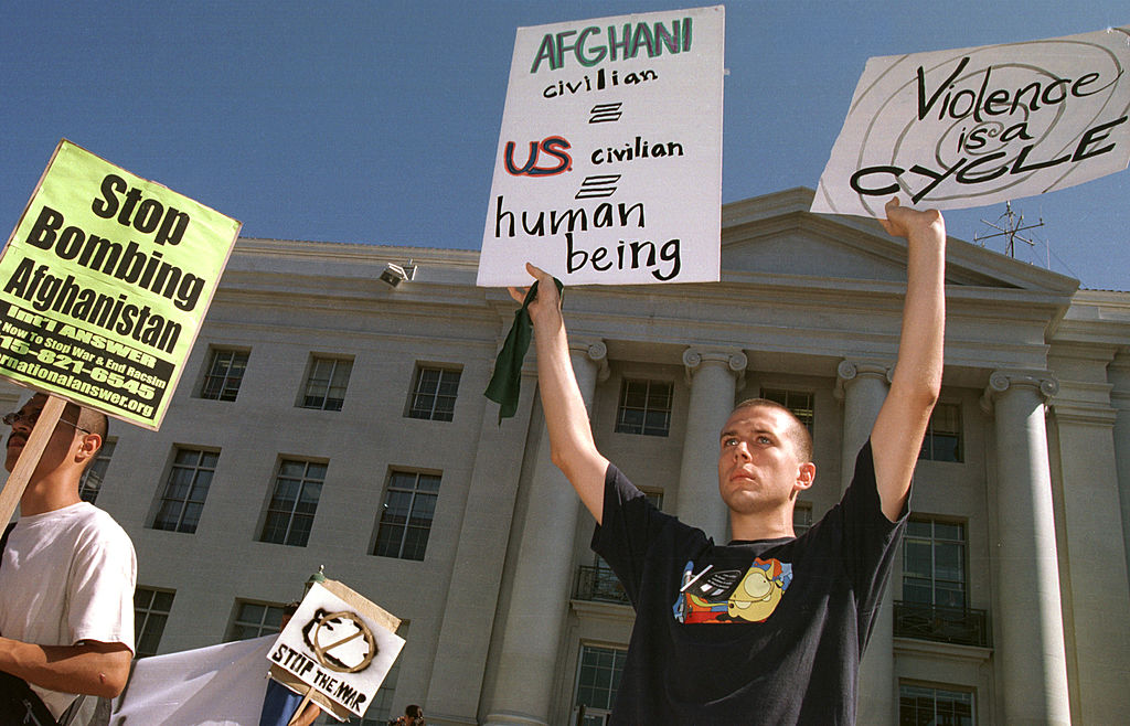 3University of California Berkeley student Russell Voth holds signs at a peace rally October 10, 2001 on the Berkeley, CA campus.