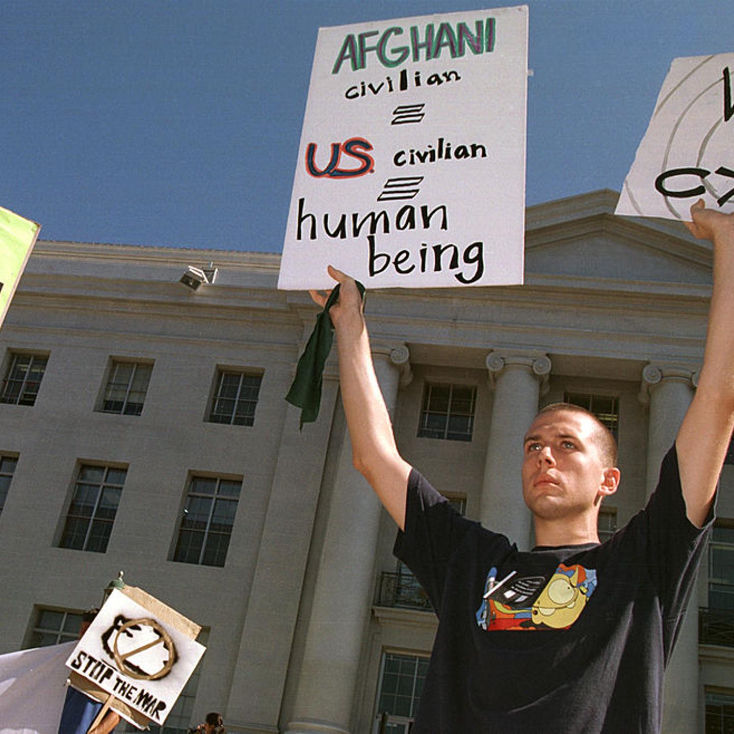 3University of California Berkeley student Russell Voth holds signs at a peace rally October 10, 2001 on the Berkeley, CA campus.