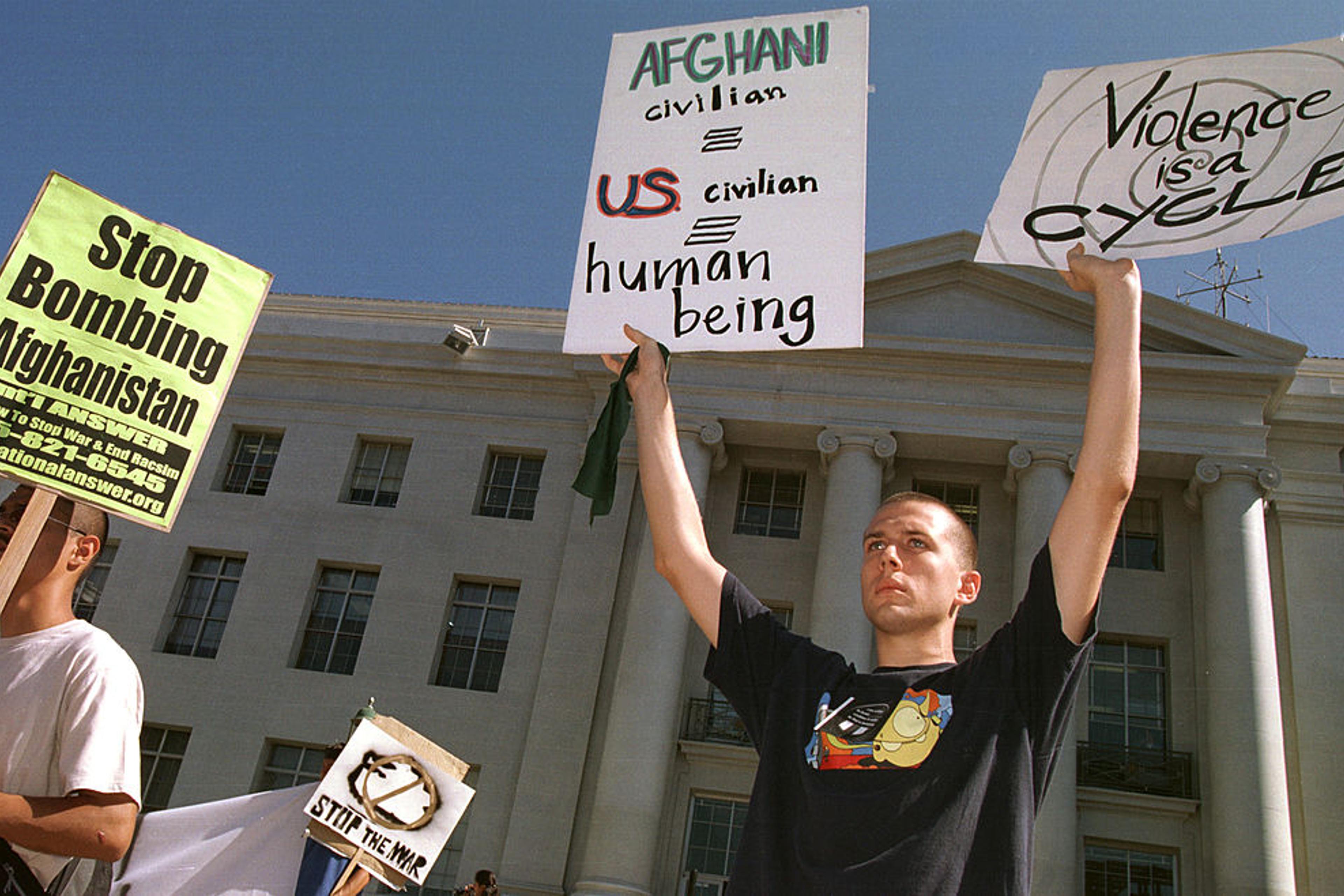 3University of California Berkeley student Russell Voth holds signs at a peace rally October 10, 2001 on the Berkeley, CA campus.