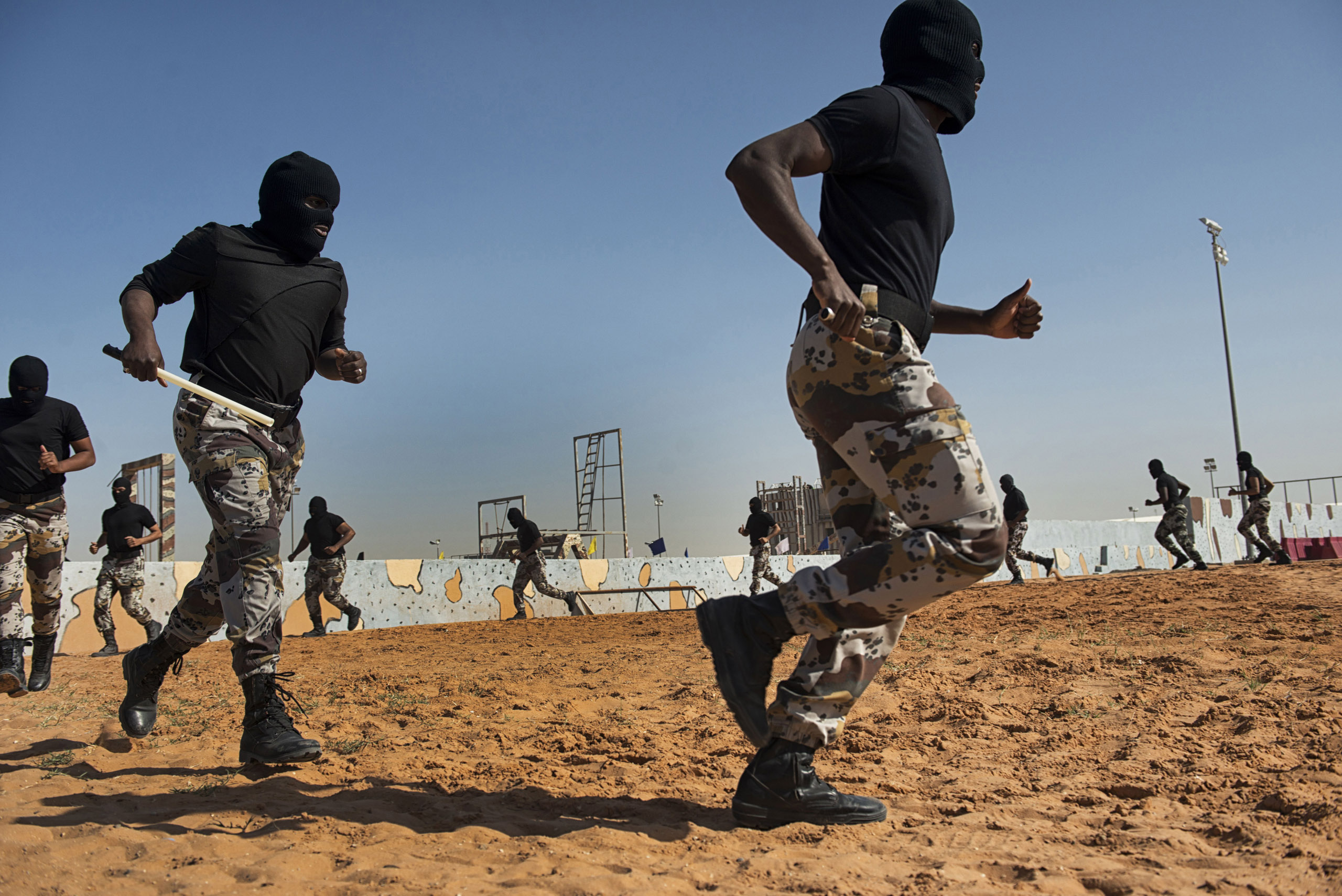 Troops with the Saudi Special Security Forces warm up and perform basic exercizes to increase strength and agility at the Counter-Terrorism Training School camp under the Ministry of Interior in Riyadh, Saudi Arabia, March 5, 2013.  The Saudi government 