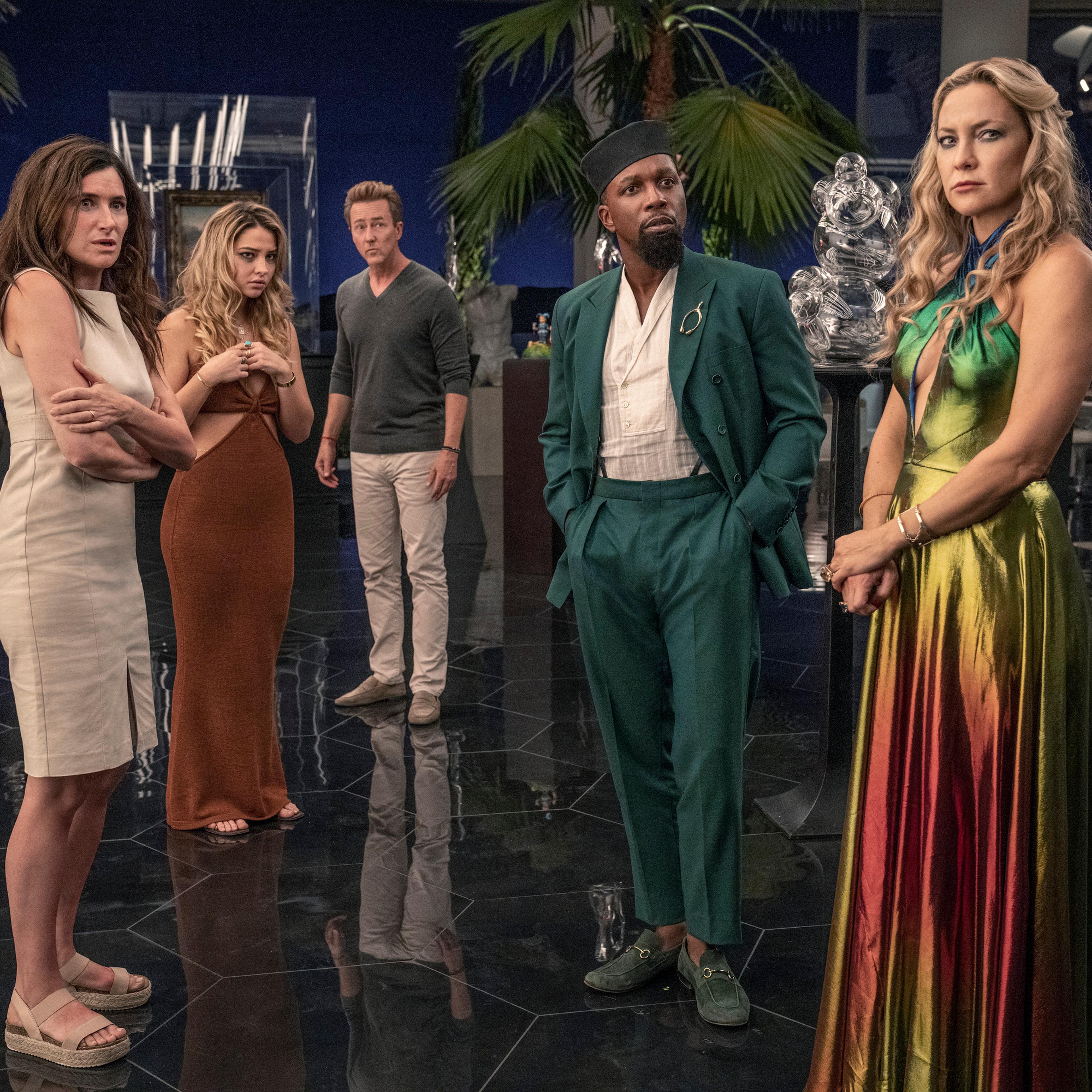 Glass Onion: A Knives Out Mystery (2022). (L-R) Kathryn Hahn as Claire, Madelyn Cline as Whiskey, Edward Norton as Miles, Leslie Odom Jr. as Lionel, and Kate Hudson as Birdie. Cr. John Wilson/Netflix © 2022.