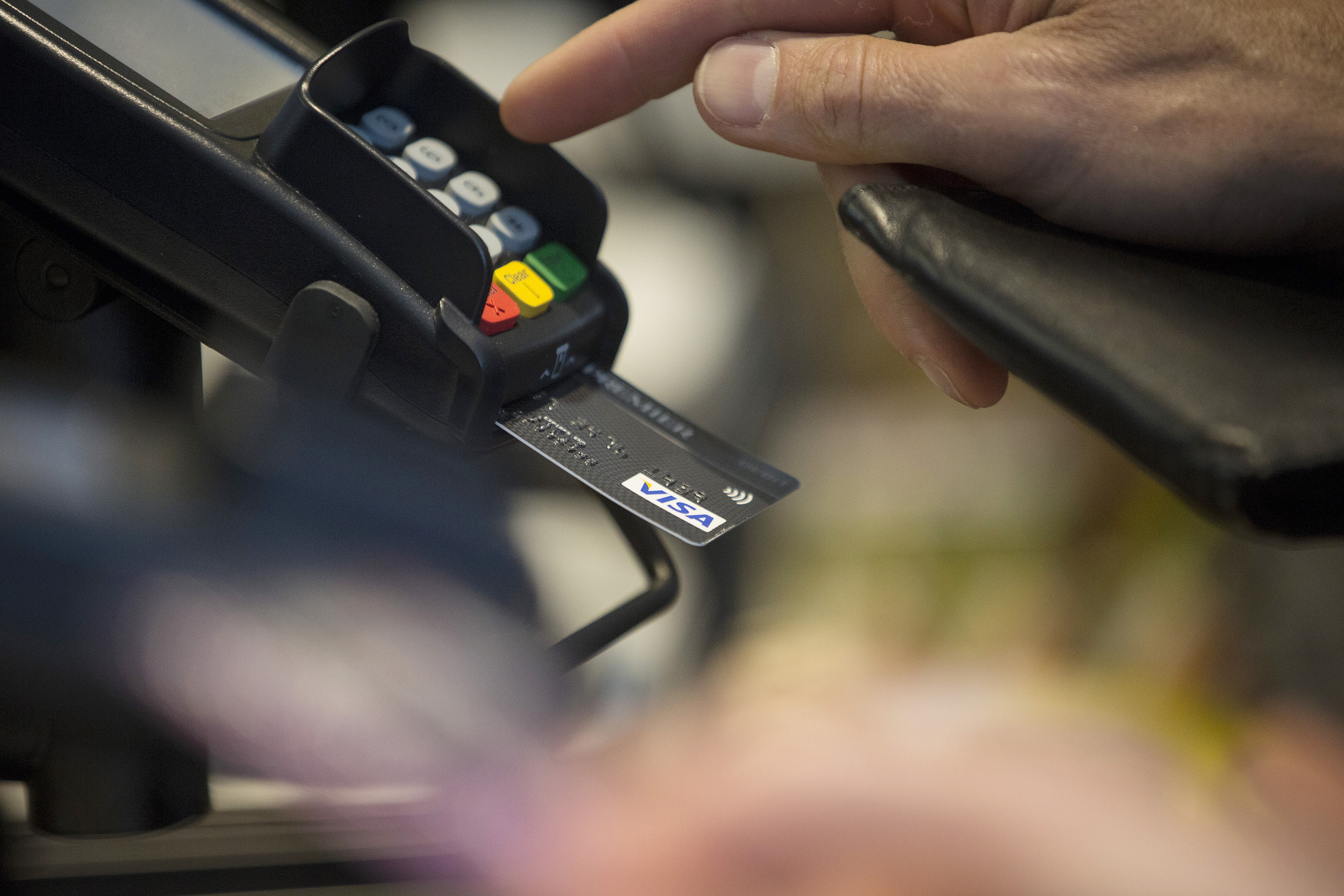 A customer enters their pin number while making a chip and pin payment using a Visa Inc. payment card,.