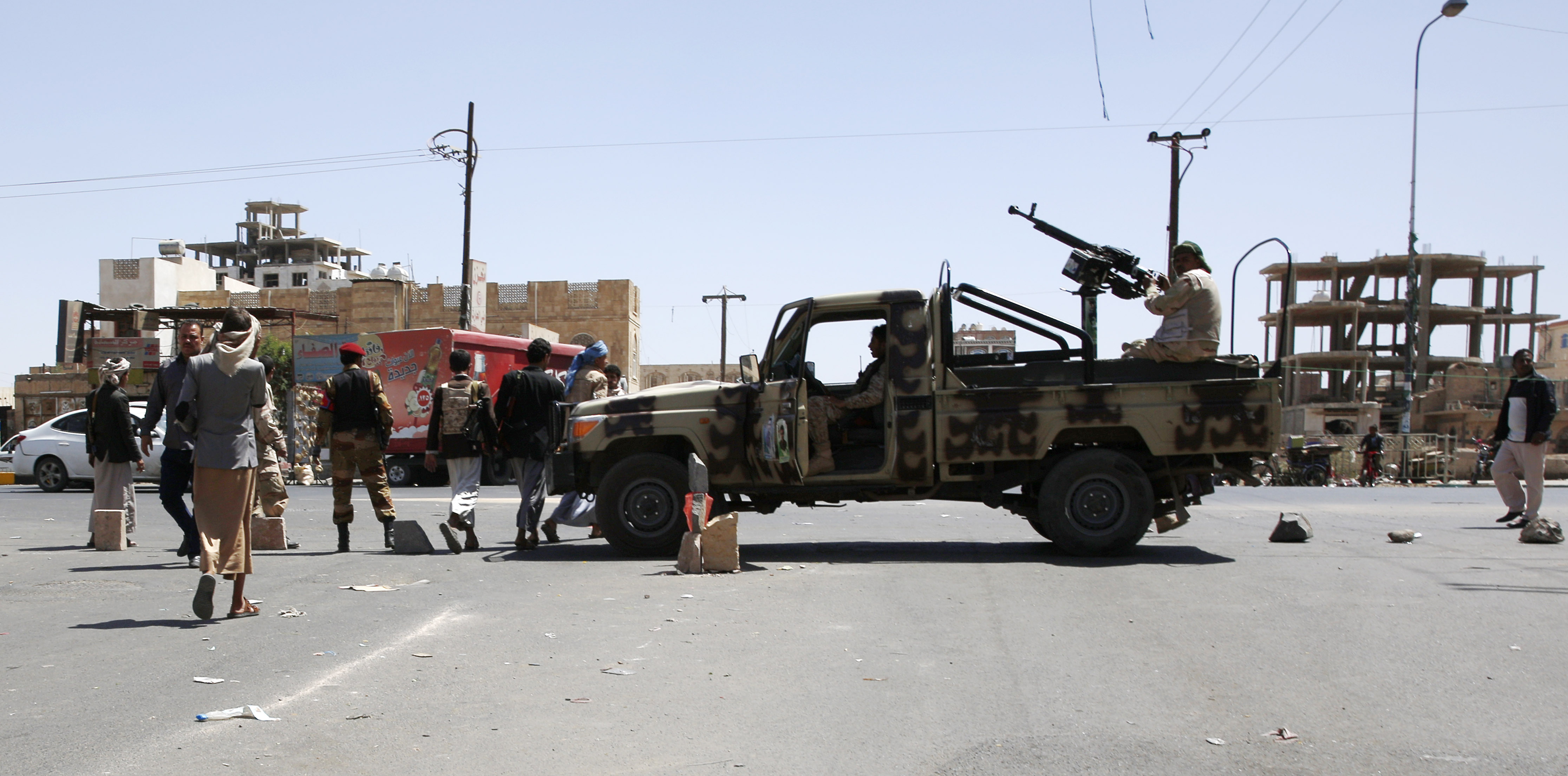 Shiite fighters, known as Houthis, guard a street leading to a tribal gathering to show support for the Houthi movement in Sanaa, Yemen on Oct. 10, 2015.