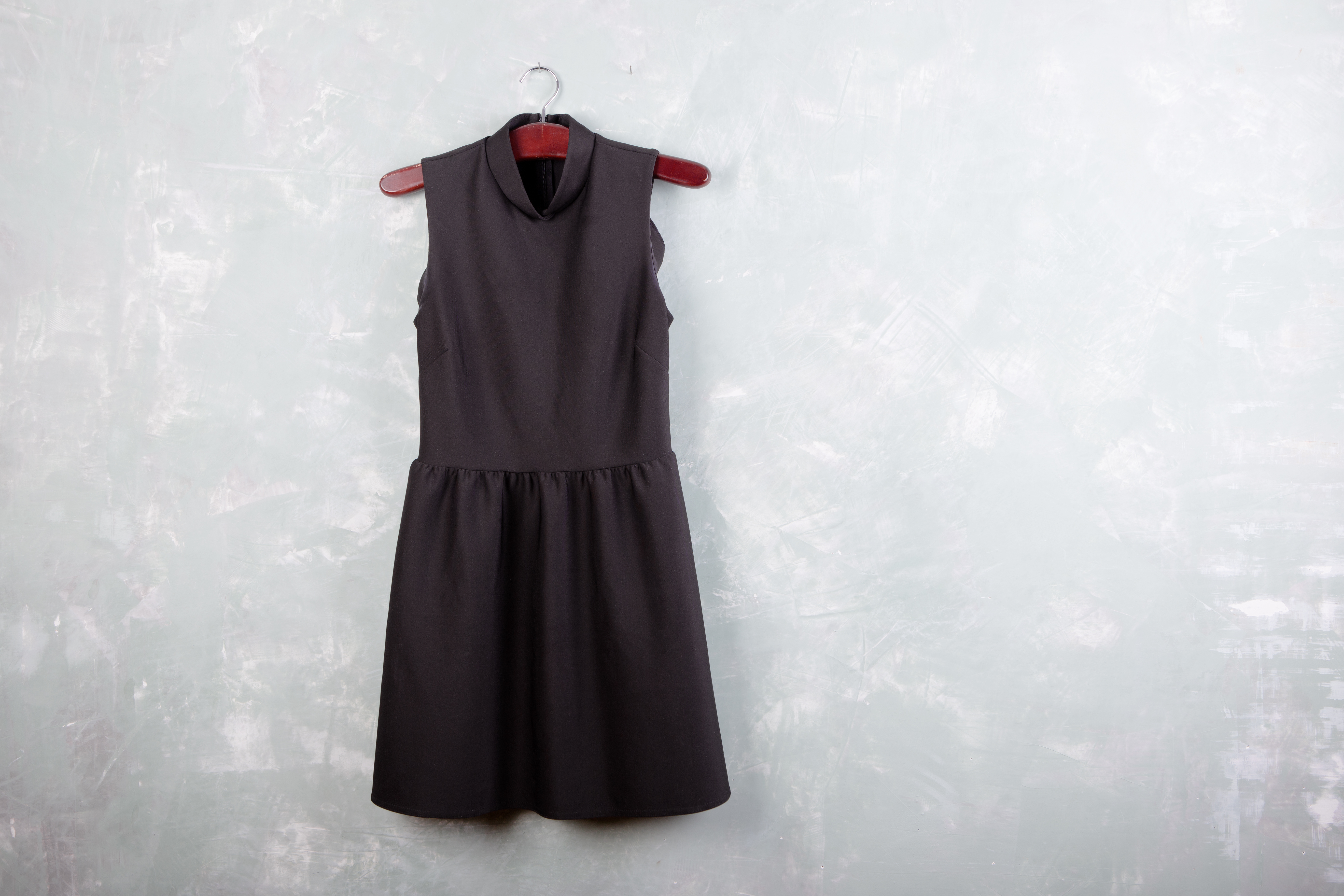 Classic little black ladies dress hanging on the hanger