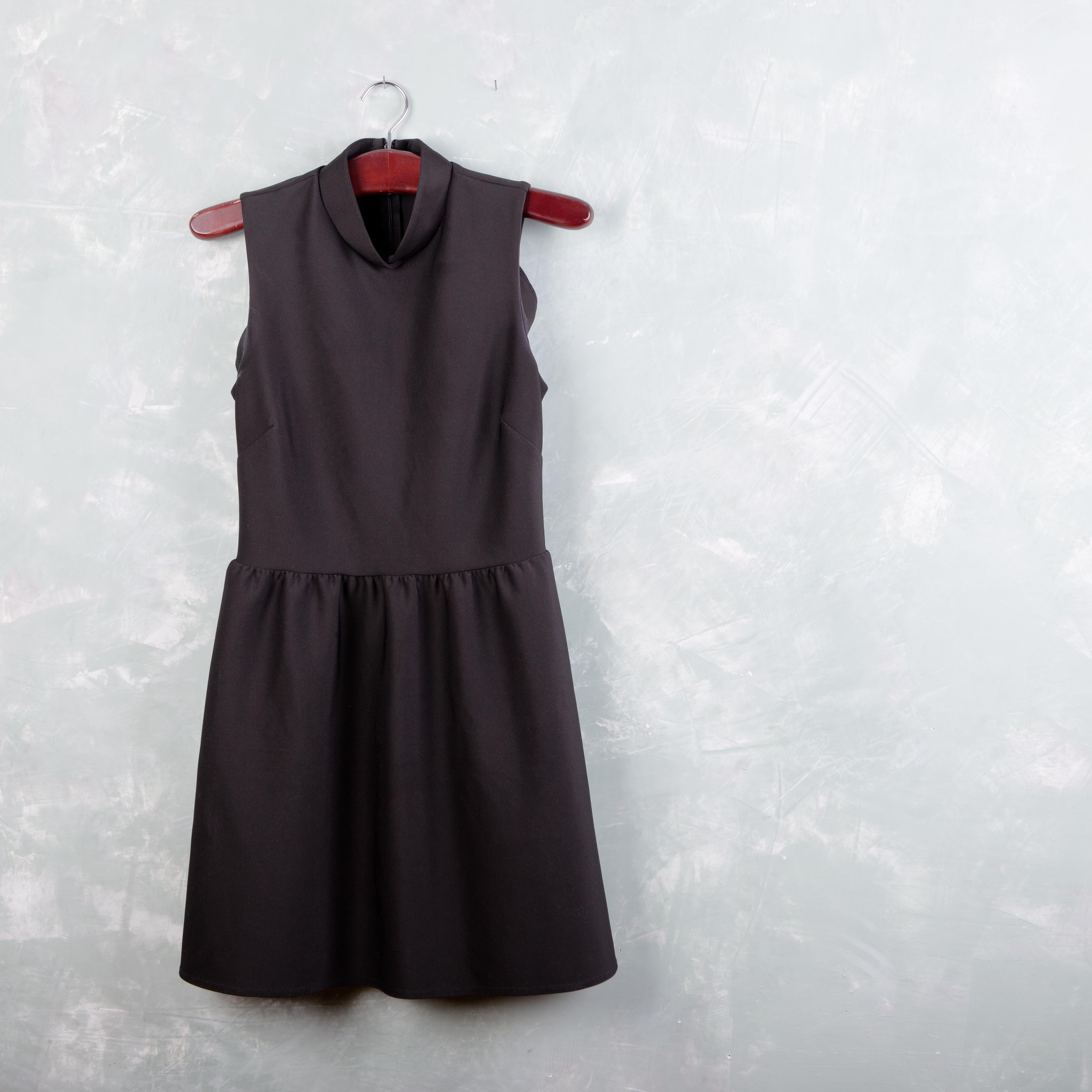 Classic little black ladies dress hanging on the hanger