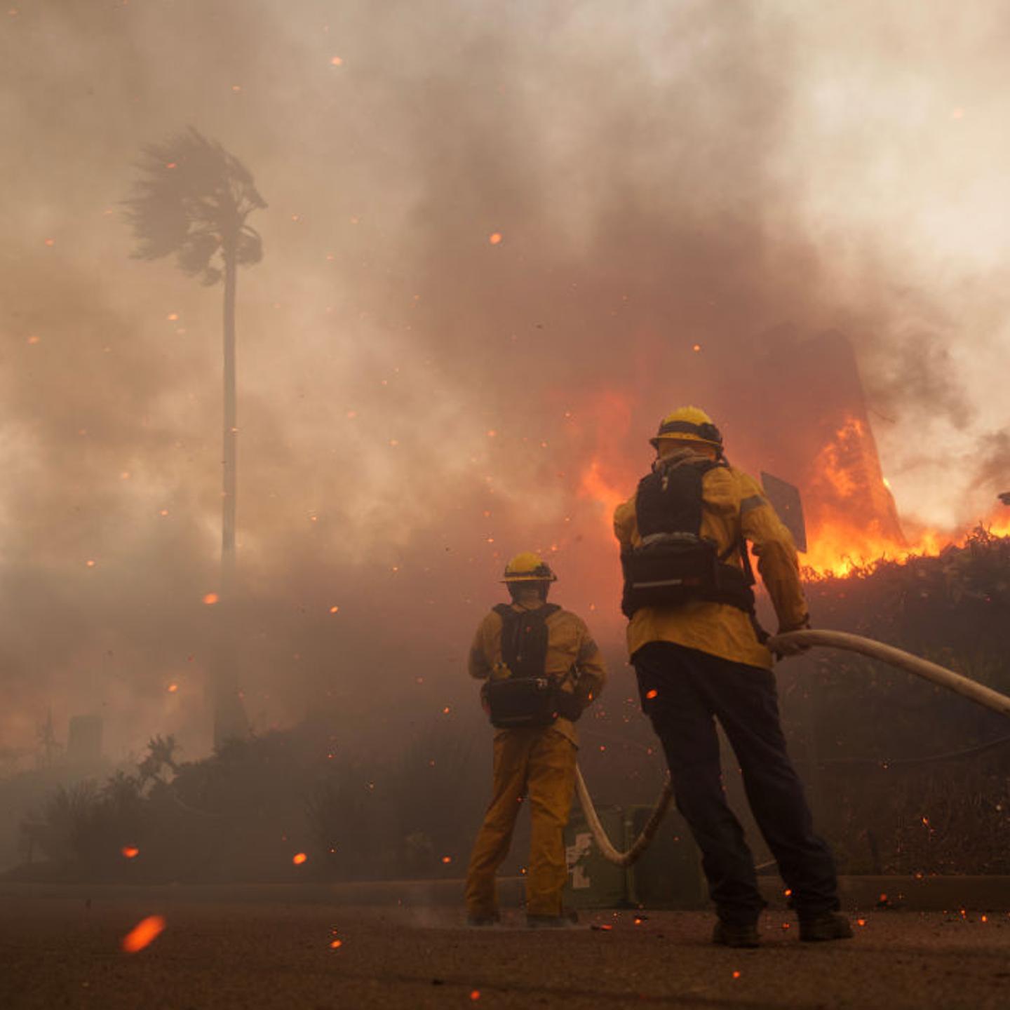 Firefighters battle flames from the Palisades Fire in the Pacific Palisades neighborhood of Los Angeles, Calif. on Jan. 7, 2025.